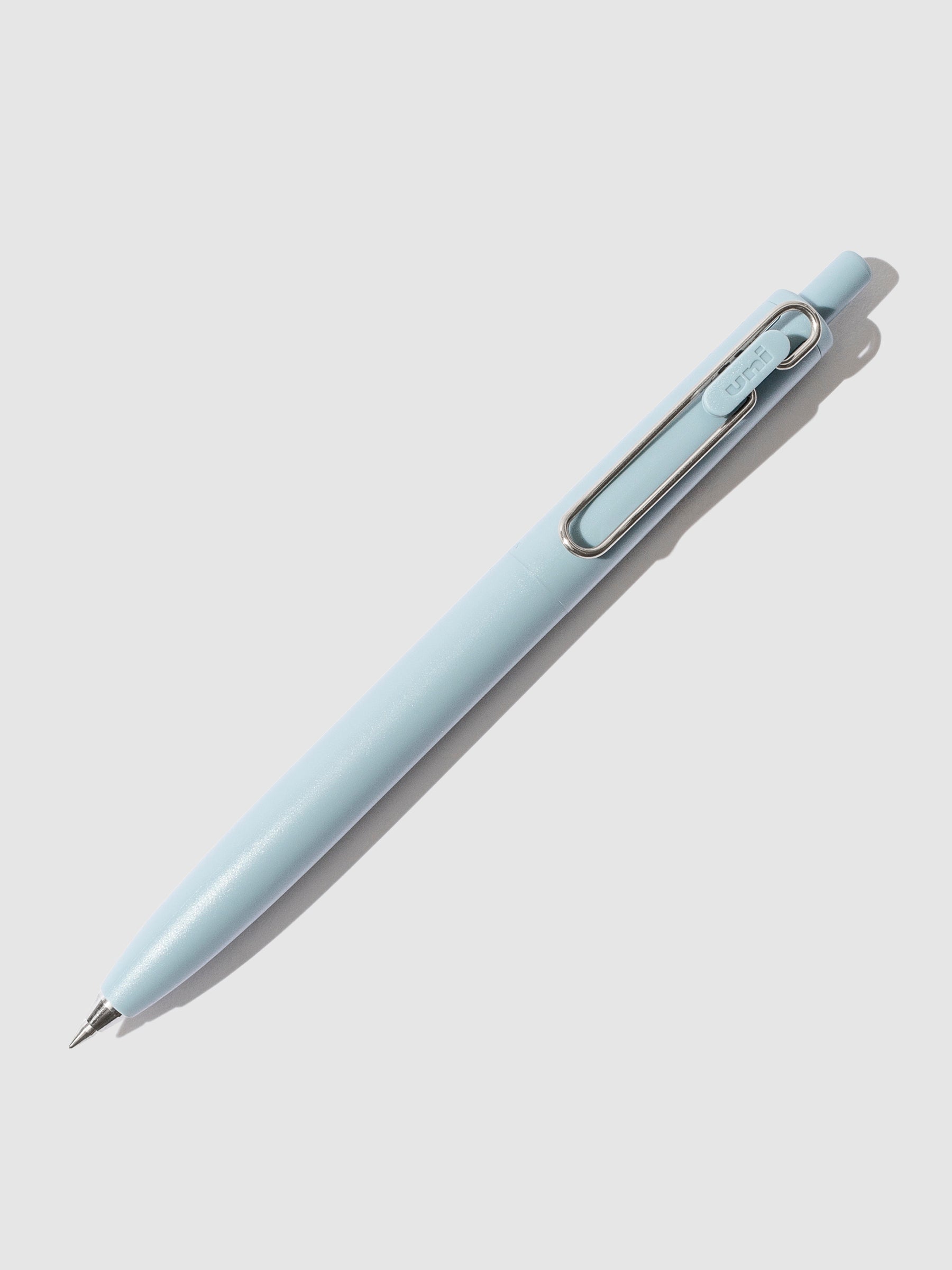 Uni-ball One F Gel Pen with a 0.5 mm nib in Blue turned to the right against a neutral background.