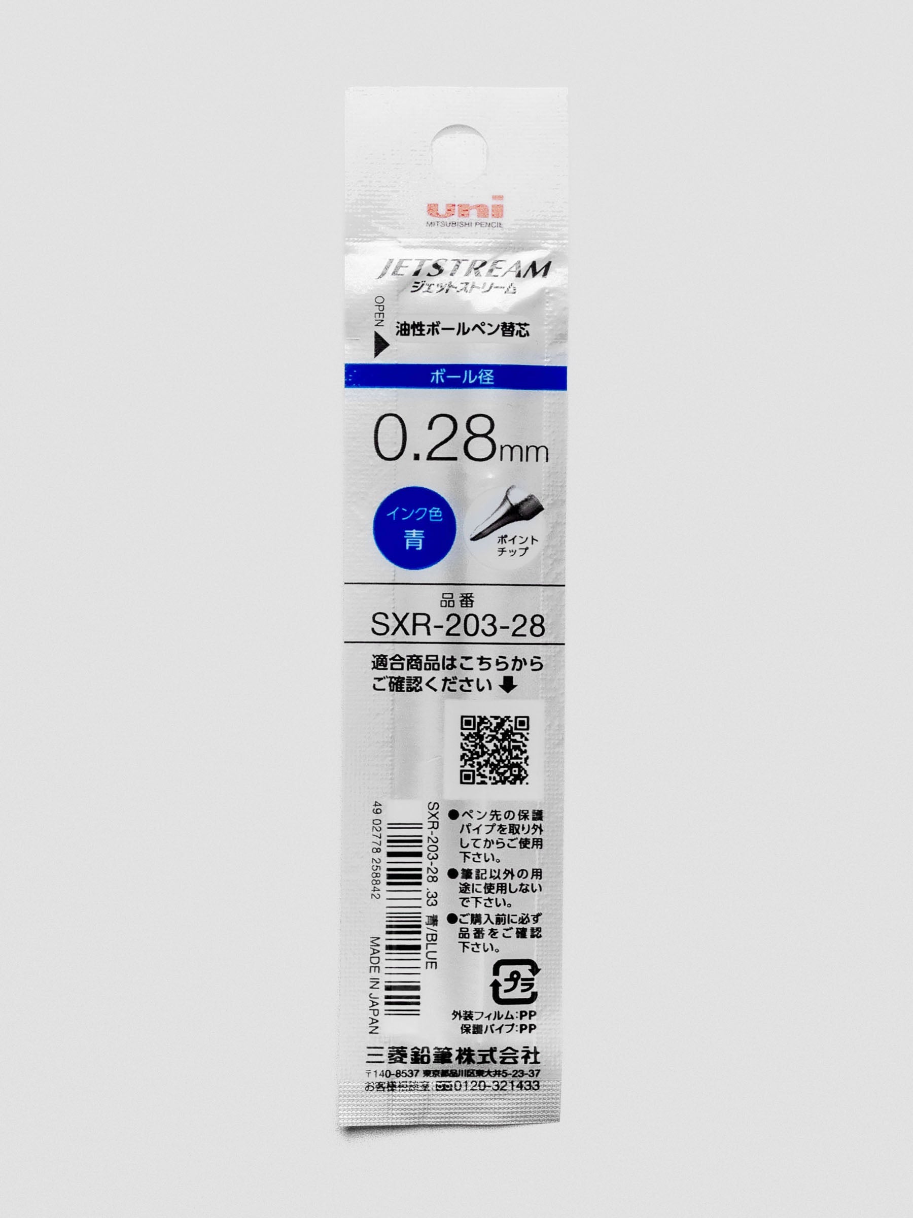 Back view of a pen refill with blue ink shown in packaging.