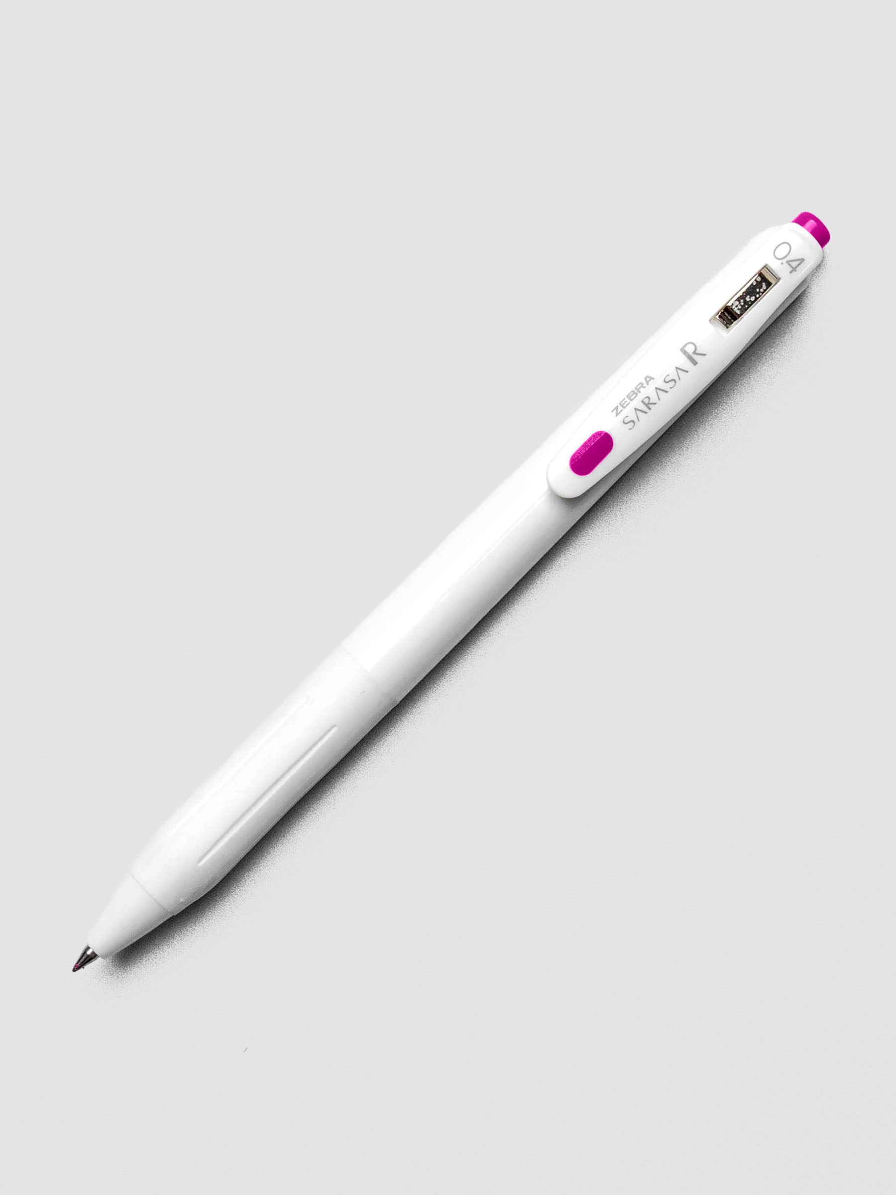 Zebra Sarasa R 0.4mm pen in magenta ink with matching clip, displayed on a white background.