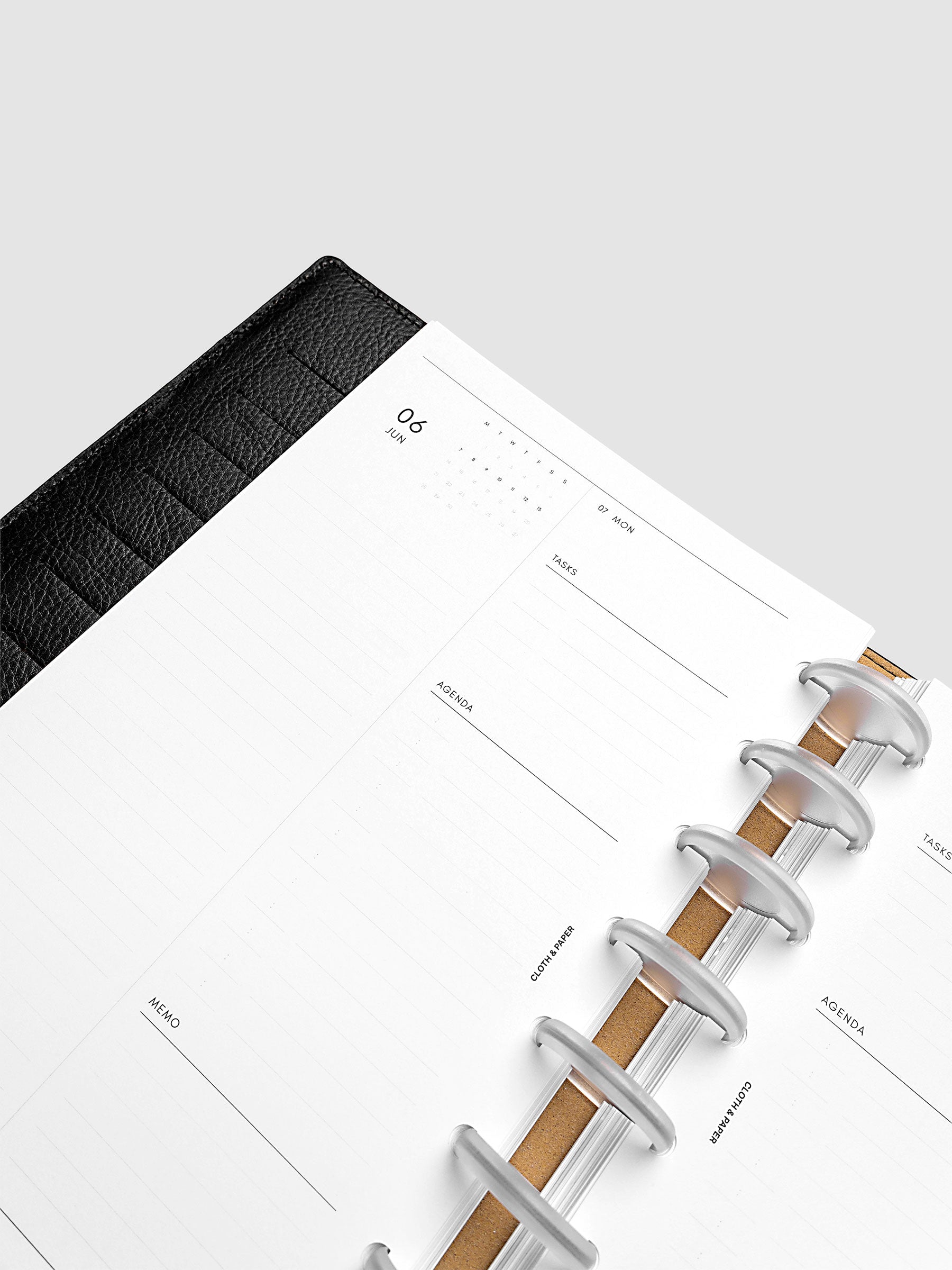 Detail view of the left page layout for the 2027 Dated Daily Inserts | Monday start in a black discbound planner