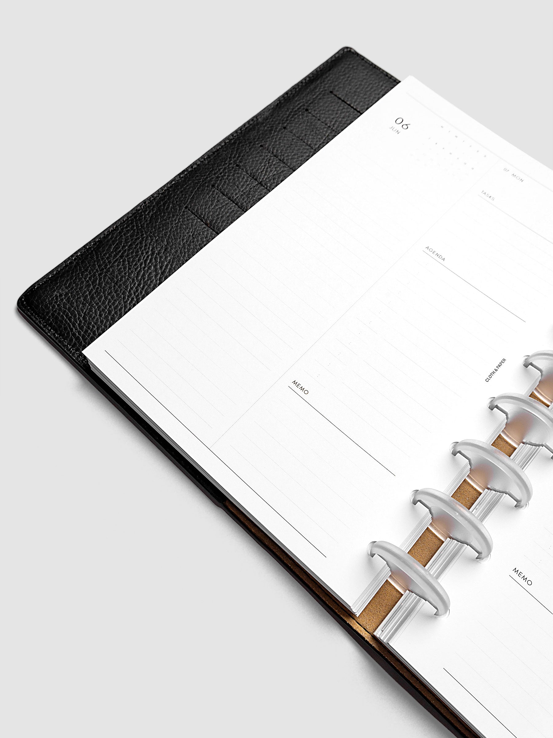Detail view of the left page layout for the 2027 Dated Daily Inserts | Monday start in a black discbound planner