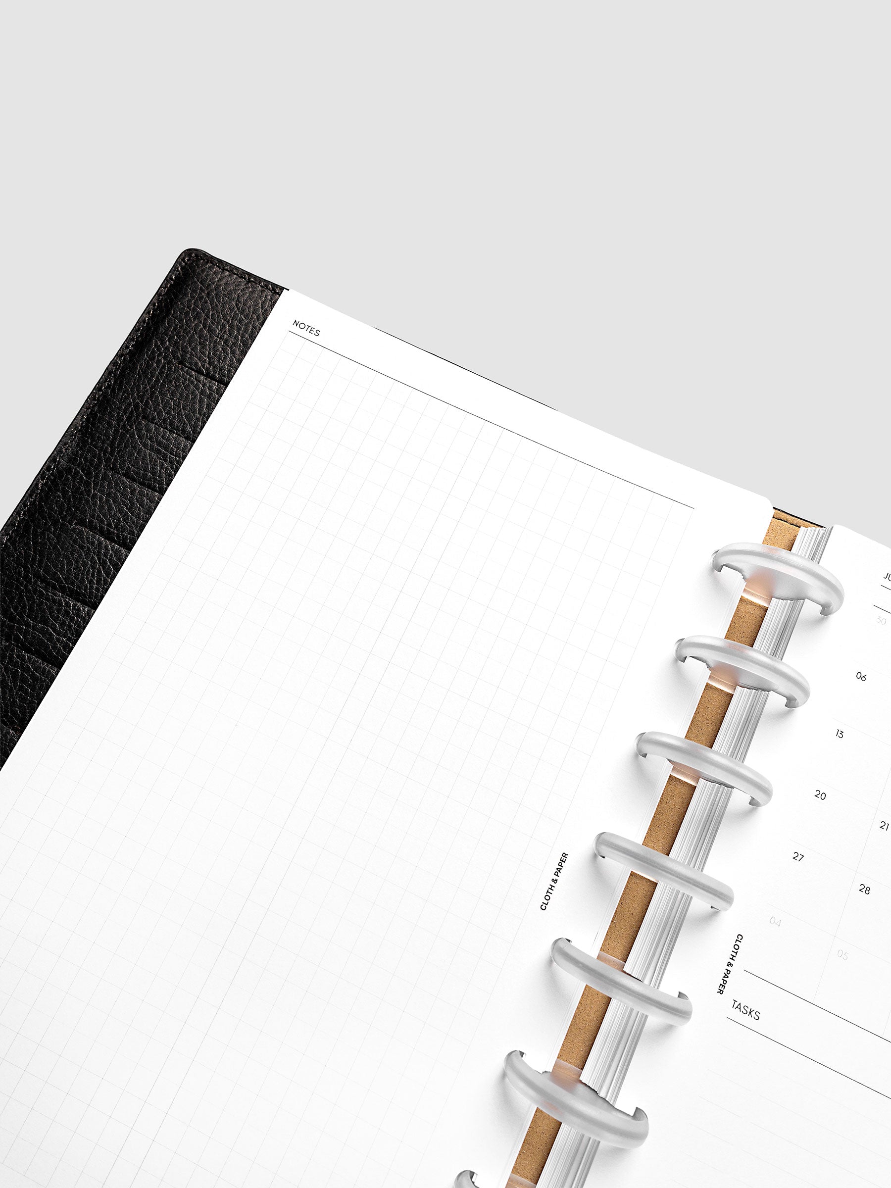 Close-up of the open graph left page in the 2027 Dated Monthly Admin Inserts, Half Letter 8-Disc Punch discbound size, showing the grid layout ready for notes, journaling, or freeform planning.