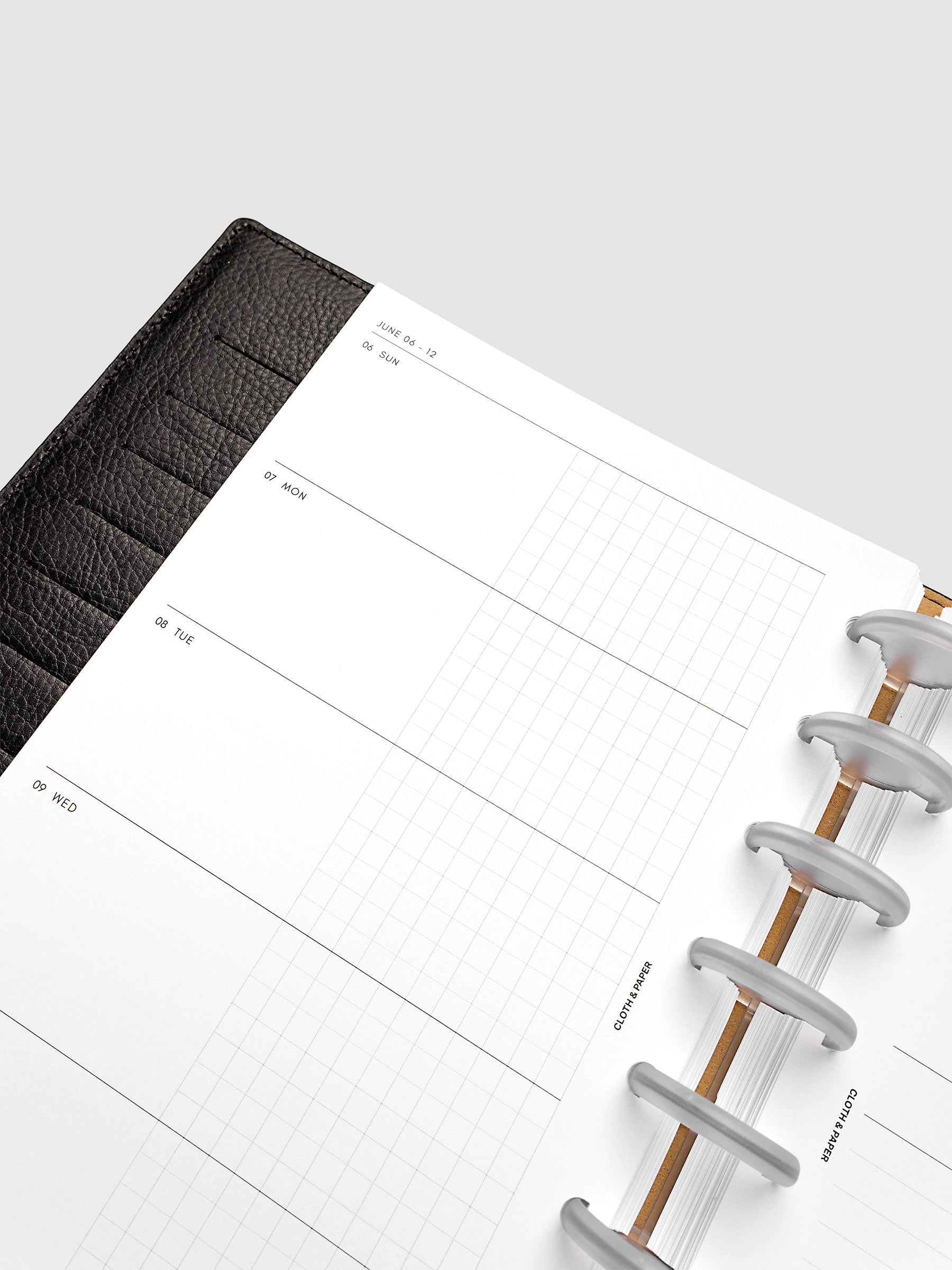 2027 Dated Weekly Horizontal Planner Inserts, Sunday Start, Half Letter 8-Disc Punch, close-up of the top of the left page showing Sunday through Thursday with each day split into open and graph columns