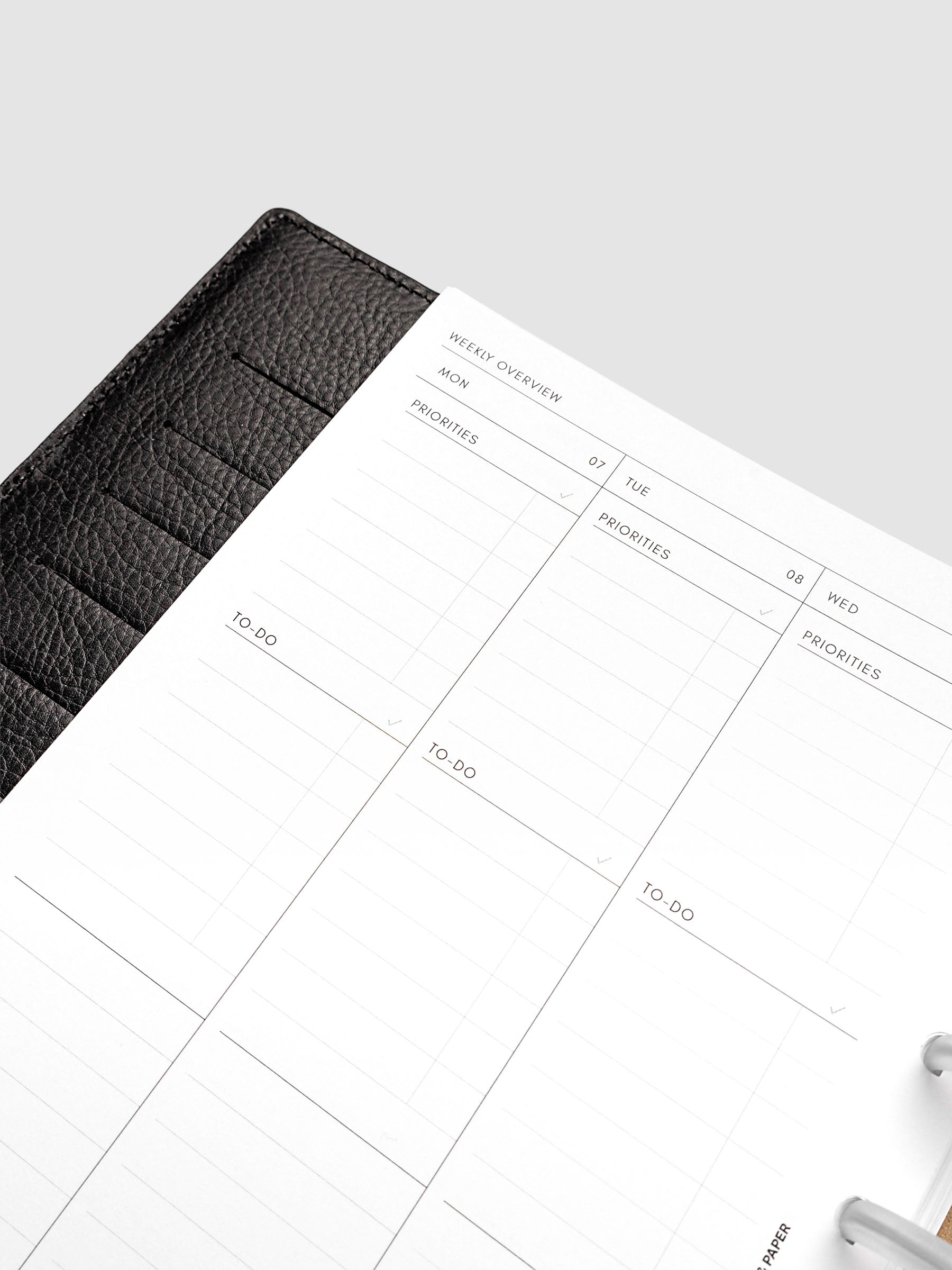 2027 Dated Weekly Task Planner Inserts, Monday Start, Half Letter 8-Disc Punch, close-up of the top of the left page showing labeled priorities and to-do sections at the top of each weekday column