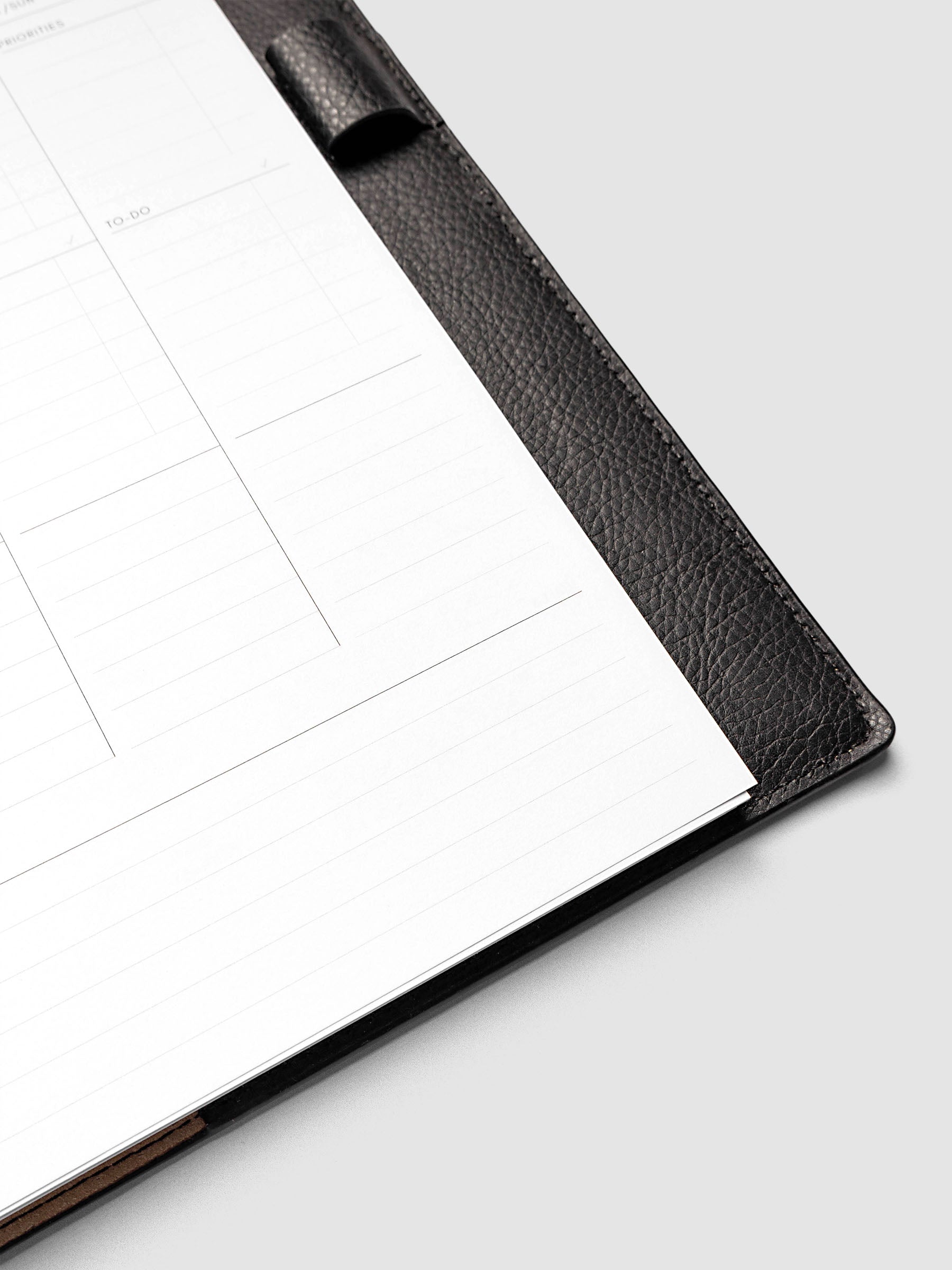 2027 Dated Weekly Task Planner Inserts, Monday Start, Half Letter 8-Disc Punch, close-up of the bottom of the right page showing open daily notes space, combined Saturday and Sunday column, and weekly notes section along the bottom of the spread