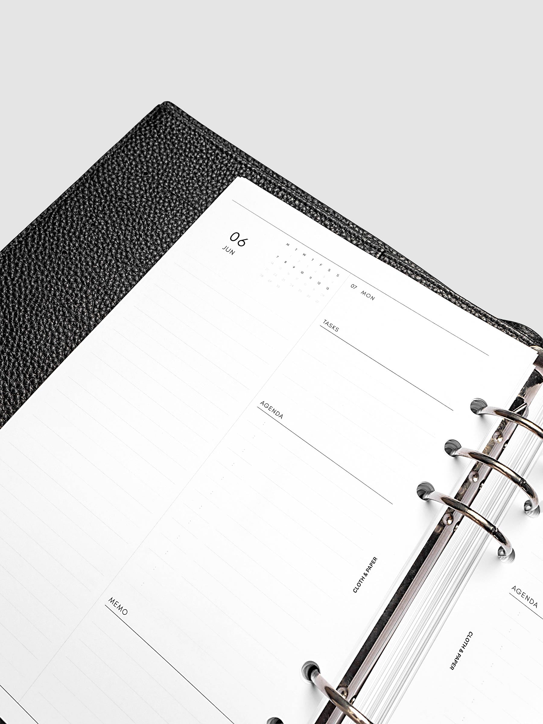 Detail view of the left page layout for the 2027 Dated Daily Inserts | Monday start in a black ringbound planner