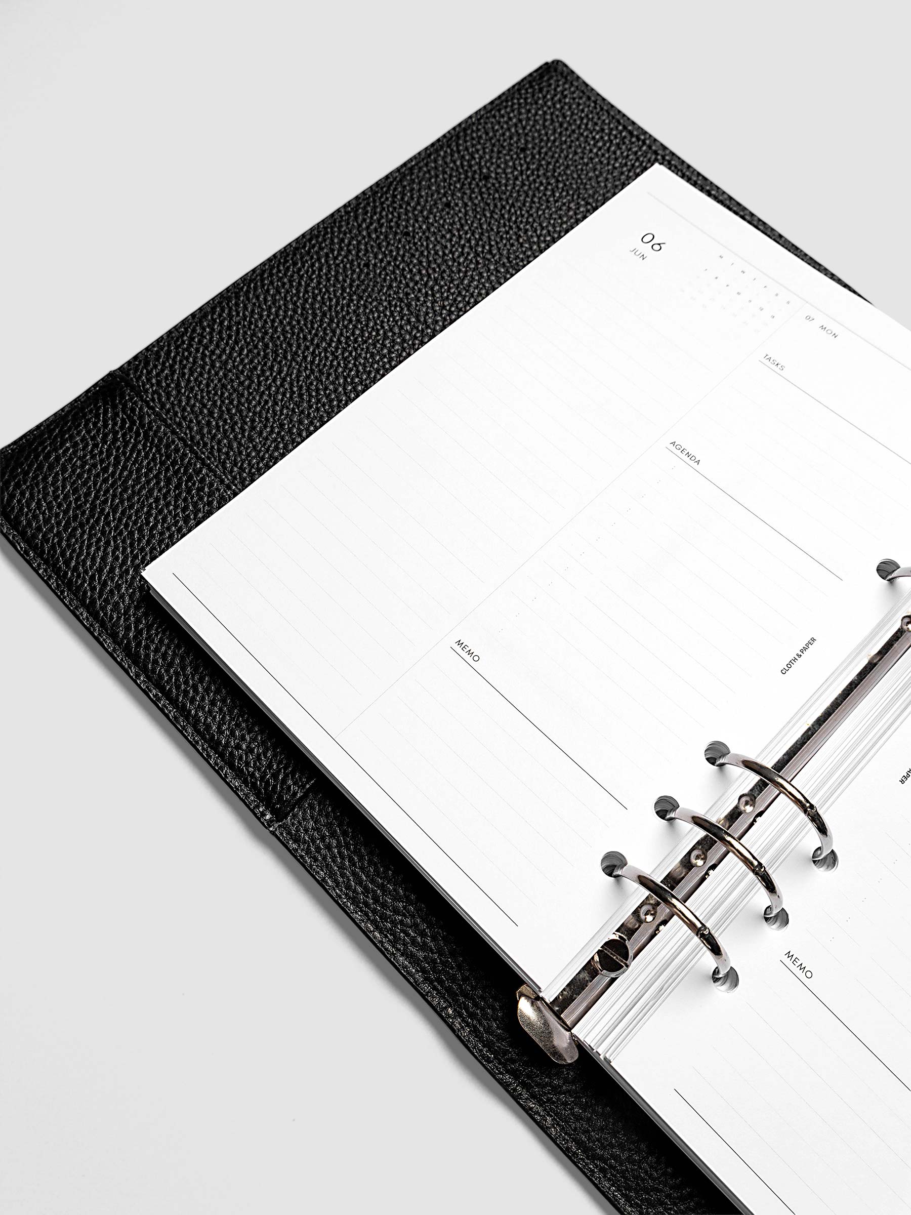Detail view of the left page layout for the 2027 Dated Daily Inserts | Monday start in a black ringbound planner