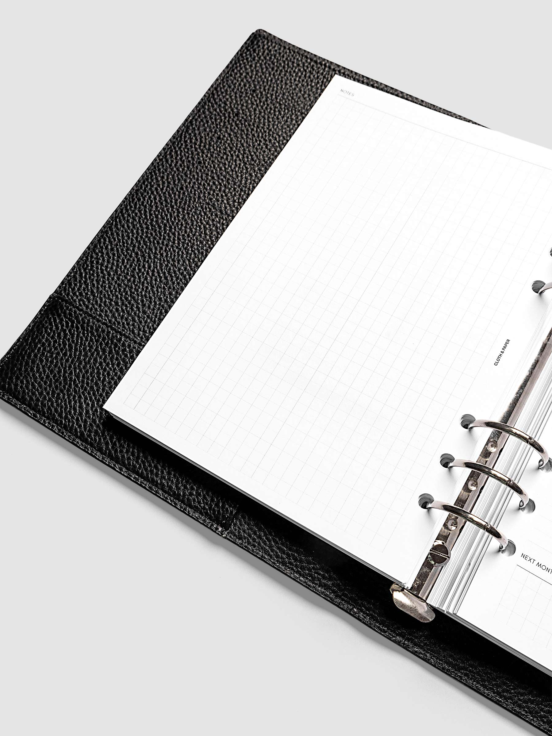 Close-up of the open graph left page in the 2027 Dated Monthly Admin Inserts, A5 6-Ring Punch 6-ring size, showing the grid layout ready for notes, journaling, or freeform planning.