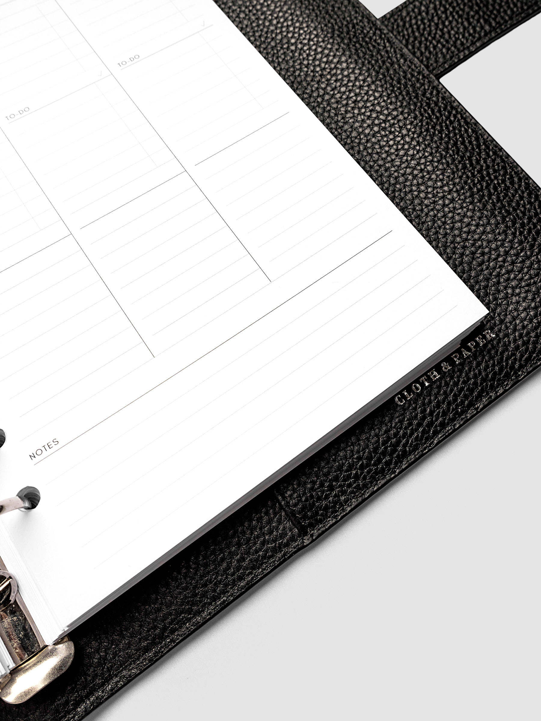 2027 Dated Weekly Task Planner Inserts, Monday Start, A5 6-Ring Punch, close-up of the bottom of the right page showing open daily notes space, combined Saturday and Sunday column, and weekly notes section along the bottom of the spread