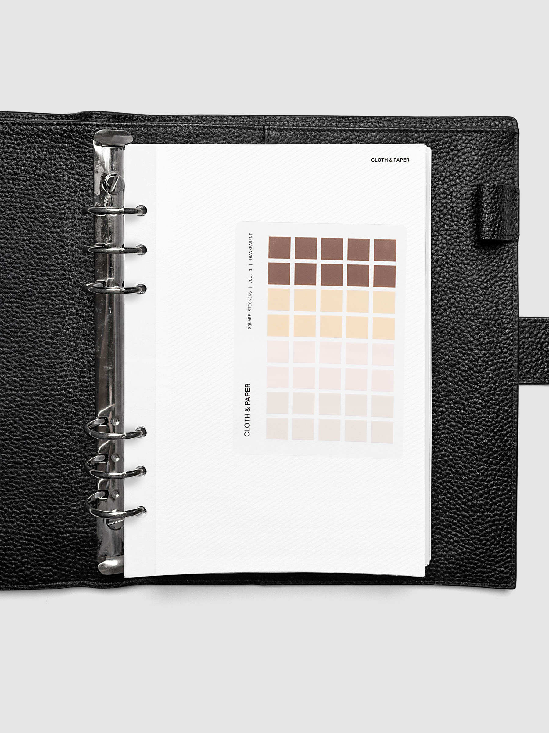 Folded Collage Planner Dashboard, A5 6-Ring Punch, stickers affixed to the adhesive surface of the open dashboard