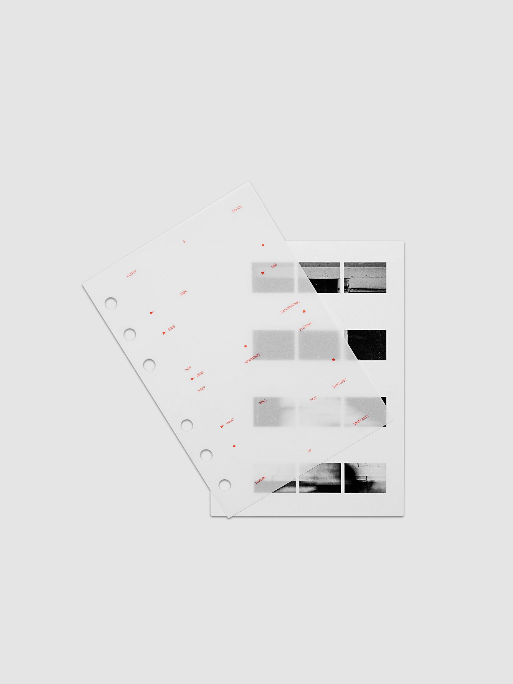 Film Strip Planner Dashboard Duo A6 6-Ring Punch two dashboards offset showing layered vellum and film strip plastic with deep orange printed details