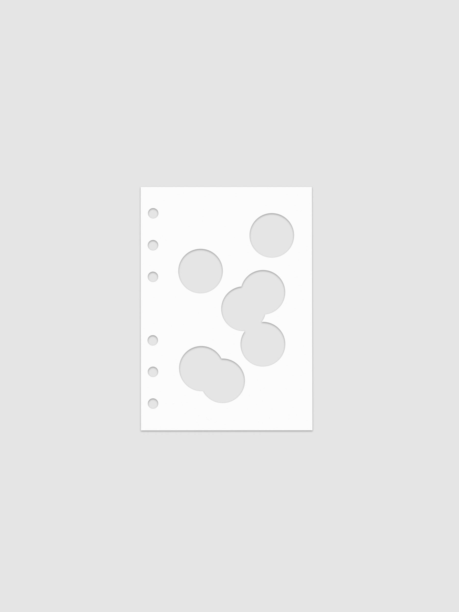 White dashboard from the Ink Blot Planner Dashboard Duo on a neutral background in size A6, pre-punched for 6-ring planners.