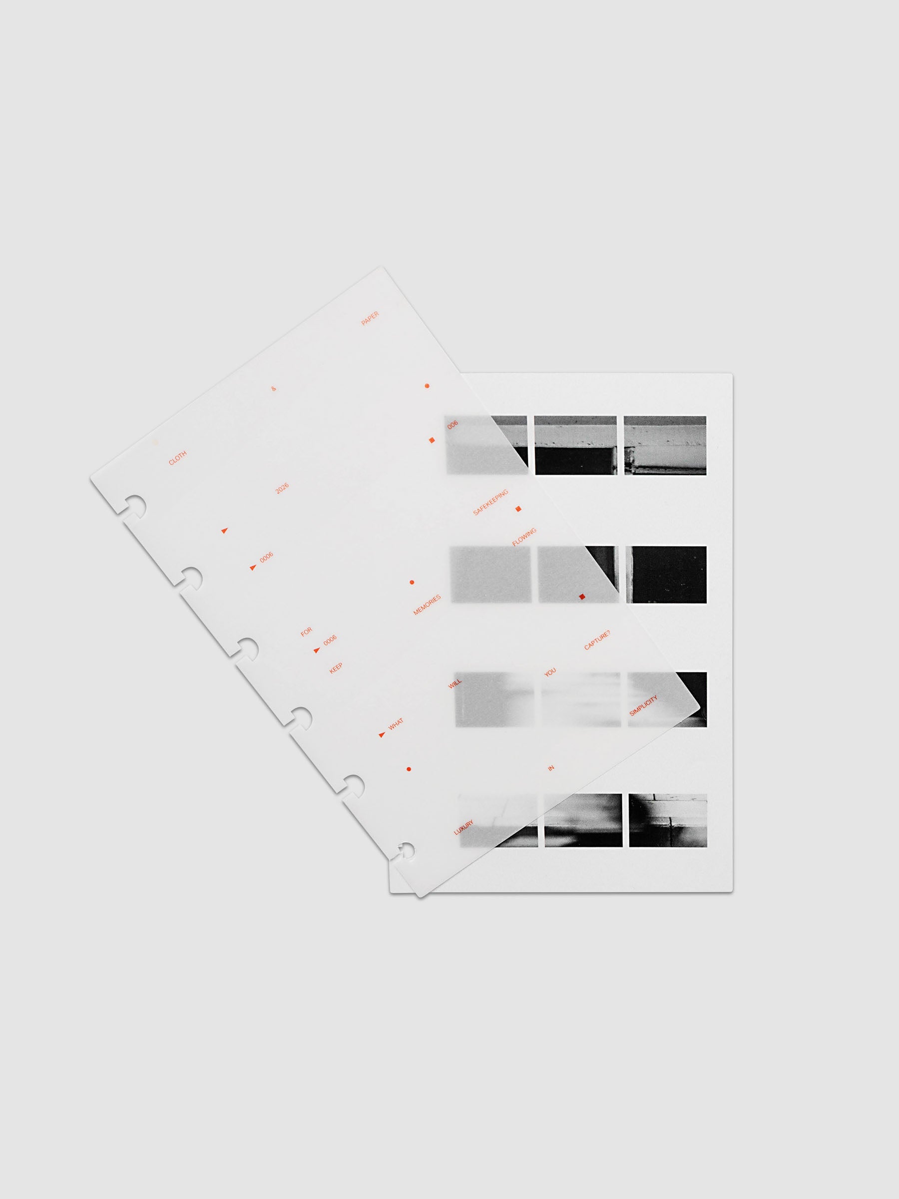 Film Strip Planner Dashboard Duo CP Petite 6-Disc Punch 6-Ring Punch two dashboards offset showing layered vellum and film strip plastic with deep orange printed details