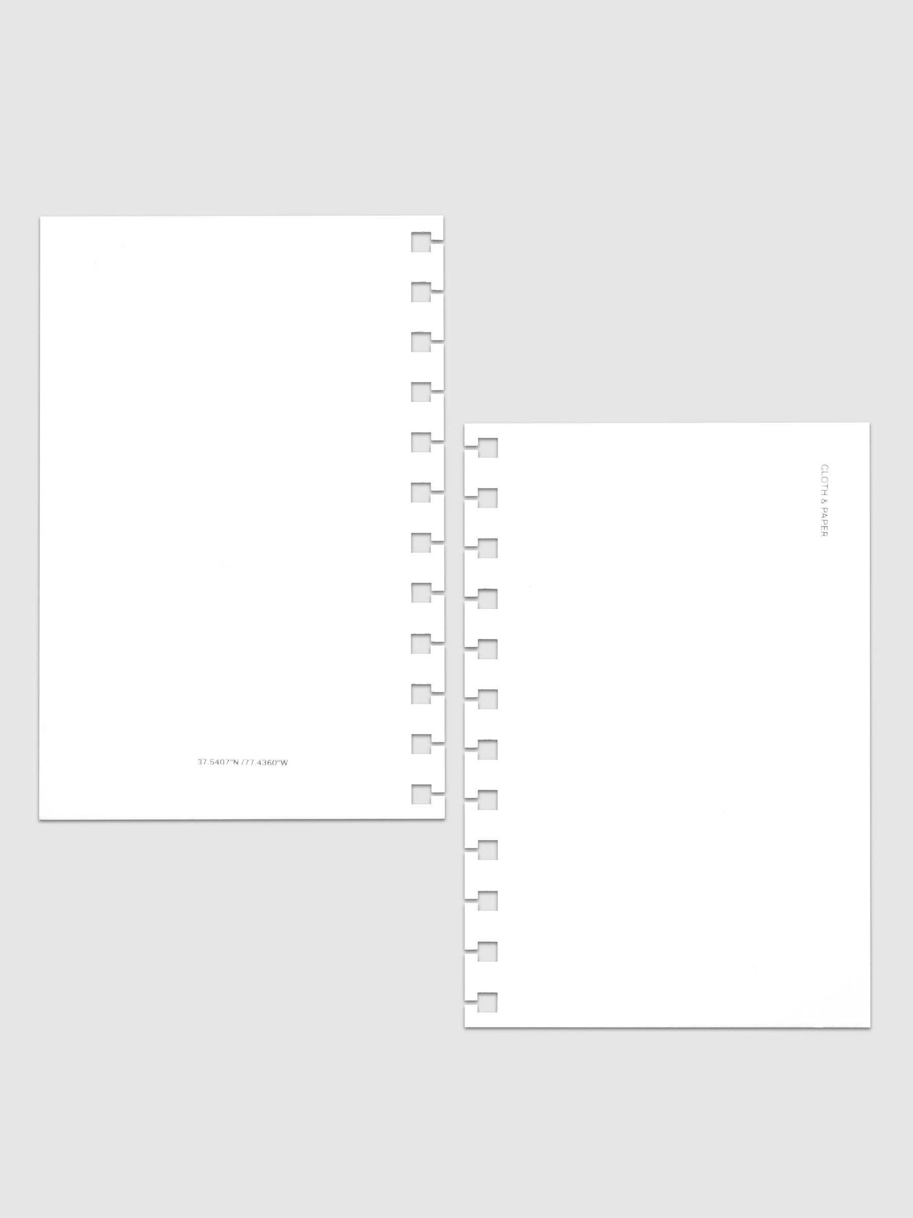 Front and back Spiral Notebook dashboards in the color Le Blanc shown in size CP Petite against a neutral background.