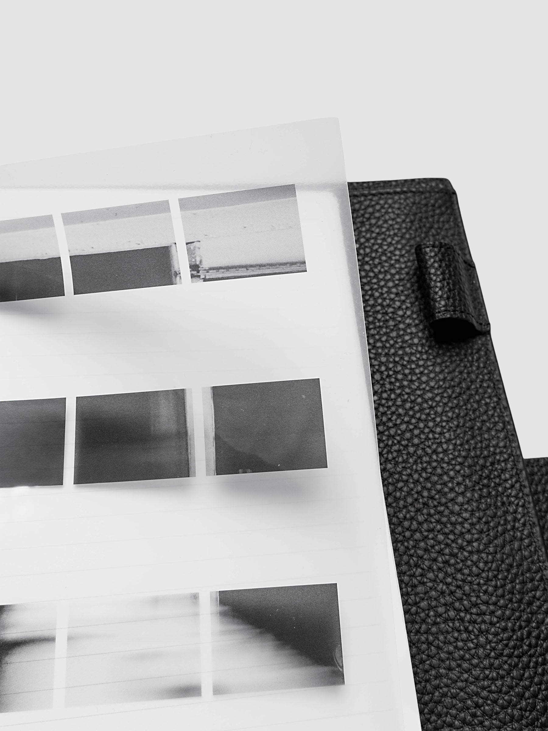 Film Strip Planner Dashboard Duo A5 6-Ring Punch top right close-up of film strip plastic bottom dashboard lifted inside a planner