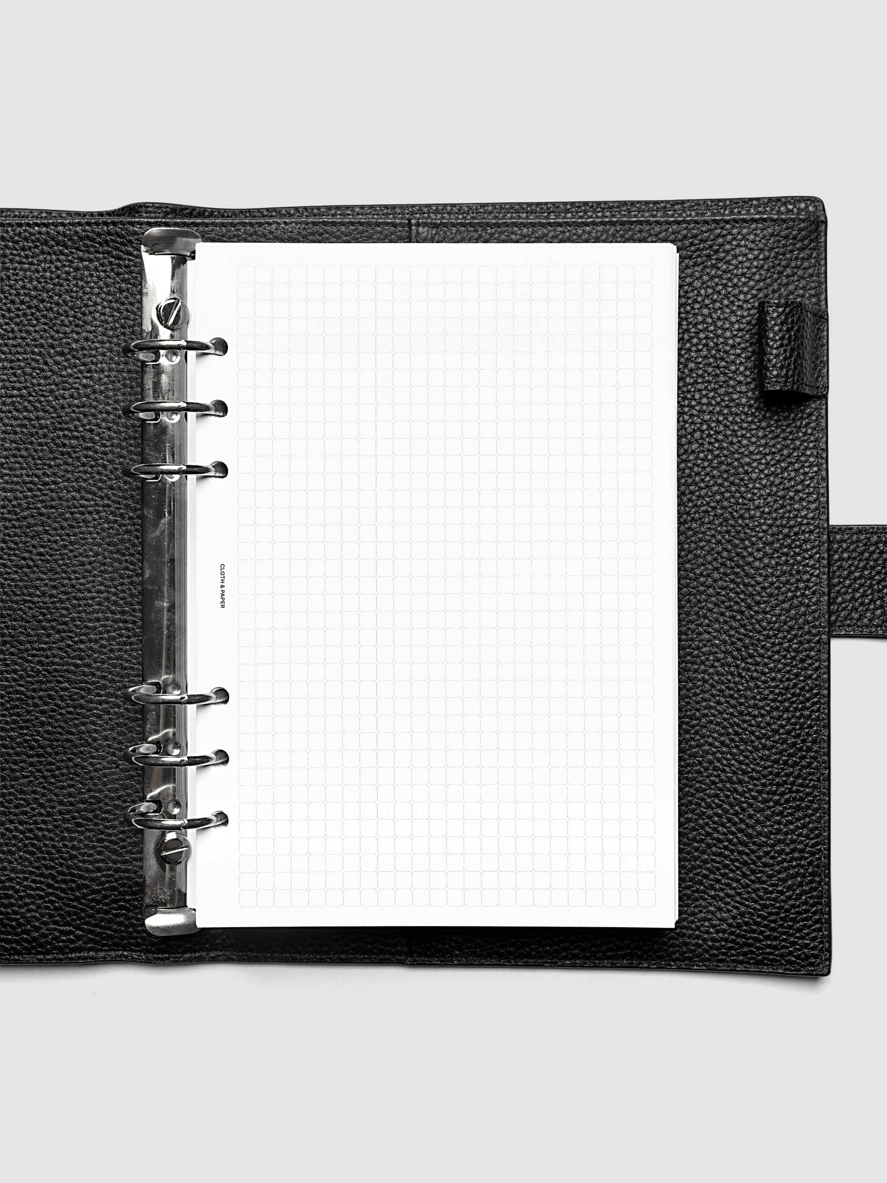 Rounded Graph Planner Insert A5 6-Ring Punch open to an unused grid page