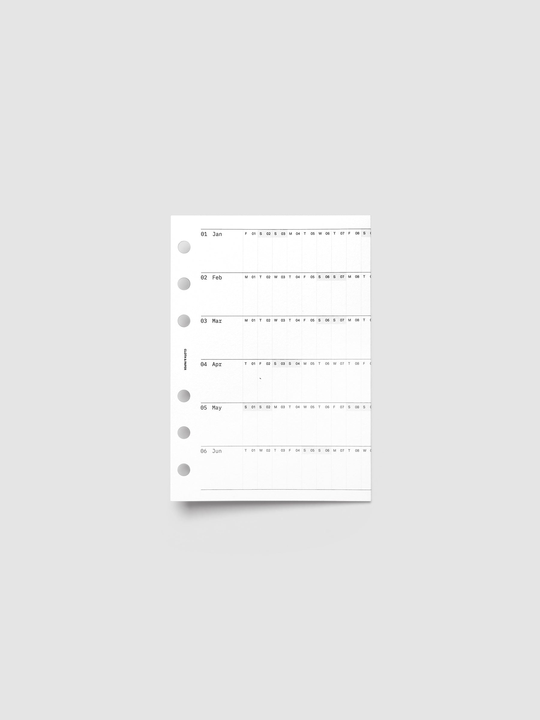 A6 6-Ring Punch 2027 Dated Fold Out Insert shown folded closed, displaying the cover side on a flat surface.