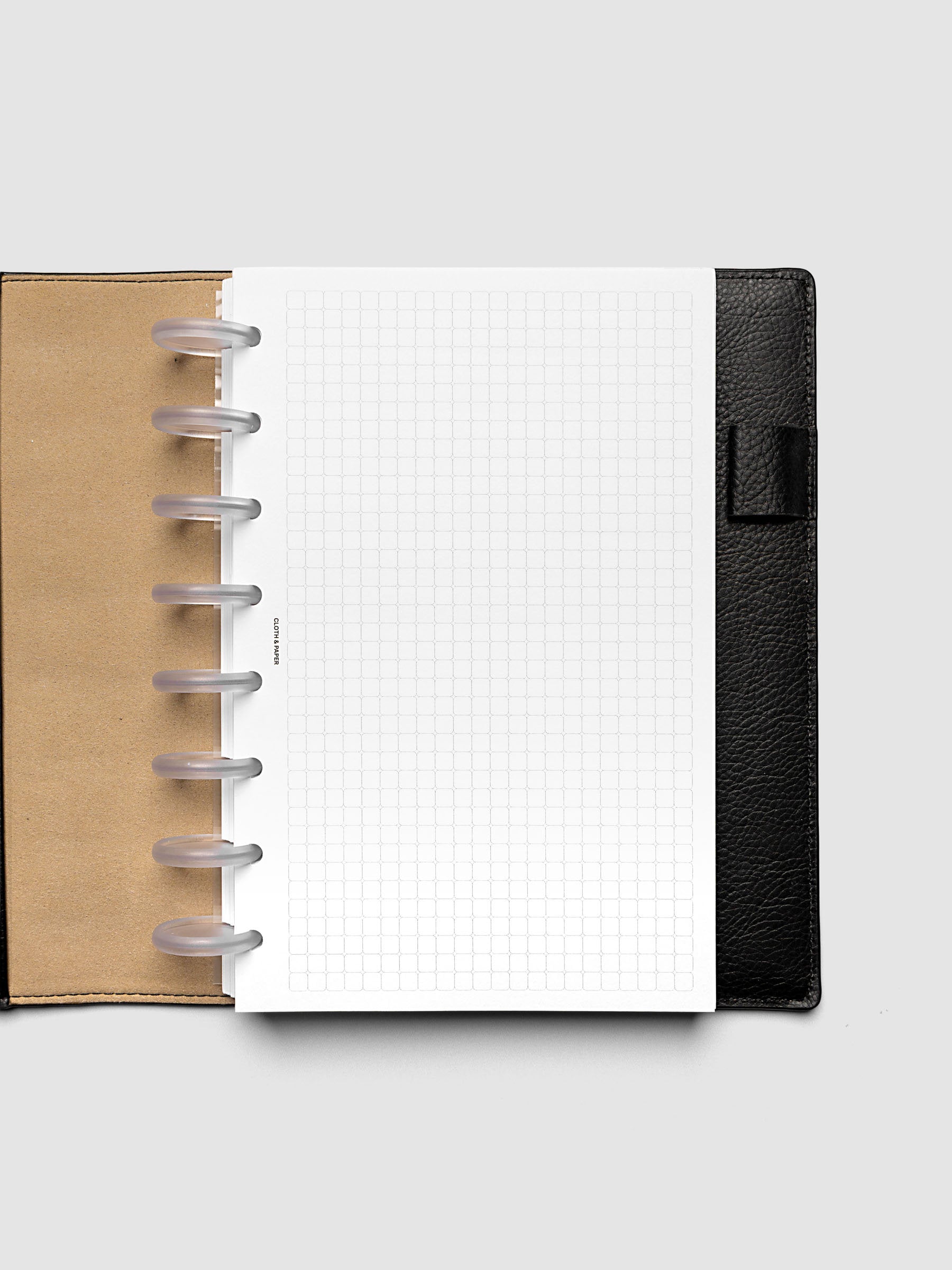 Rounded Graph Planner Insert Half Letter 8-Disc Punch open to an unused grid page