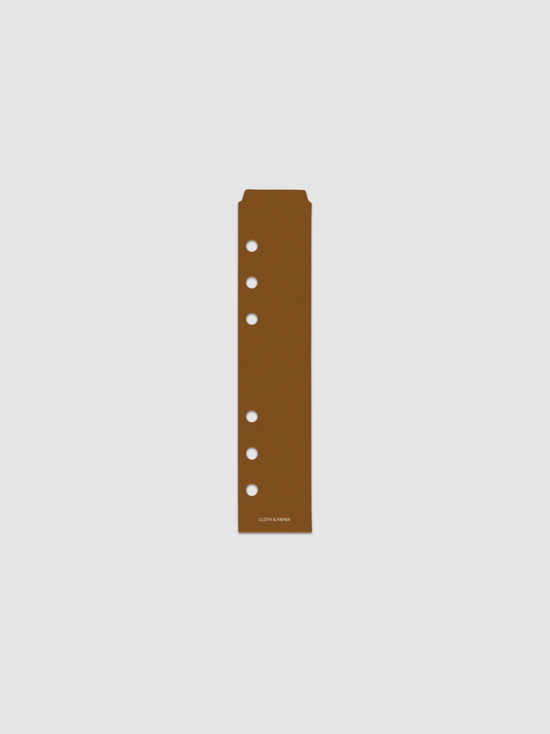 One narrow page marker in brown, shown in size Personal/Personal Wide.