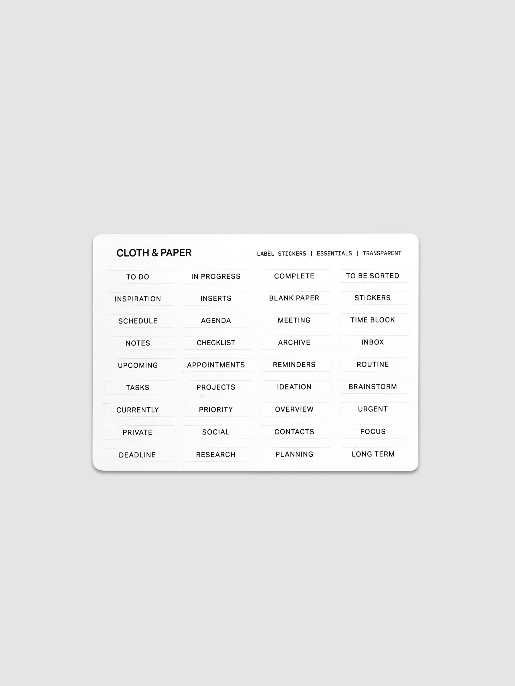 One sheet of transparent label stickers with black printed text on the theme of essentials.