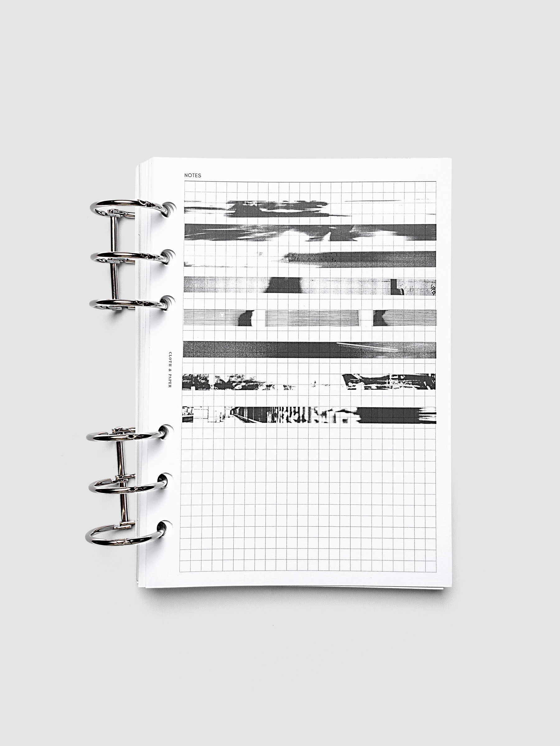 Page Pins | Long | Negatives, one of each of the 8 designs pinned to graph insert pages in a 6-ring planner