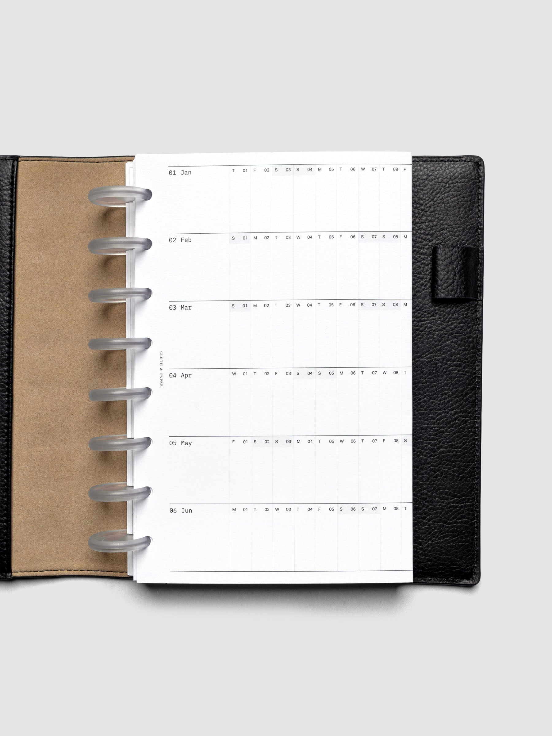 2026 Yearly Fold Out Planner Insert in size Half Letter shown folded in a black leather folio cover.