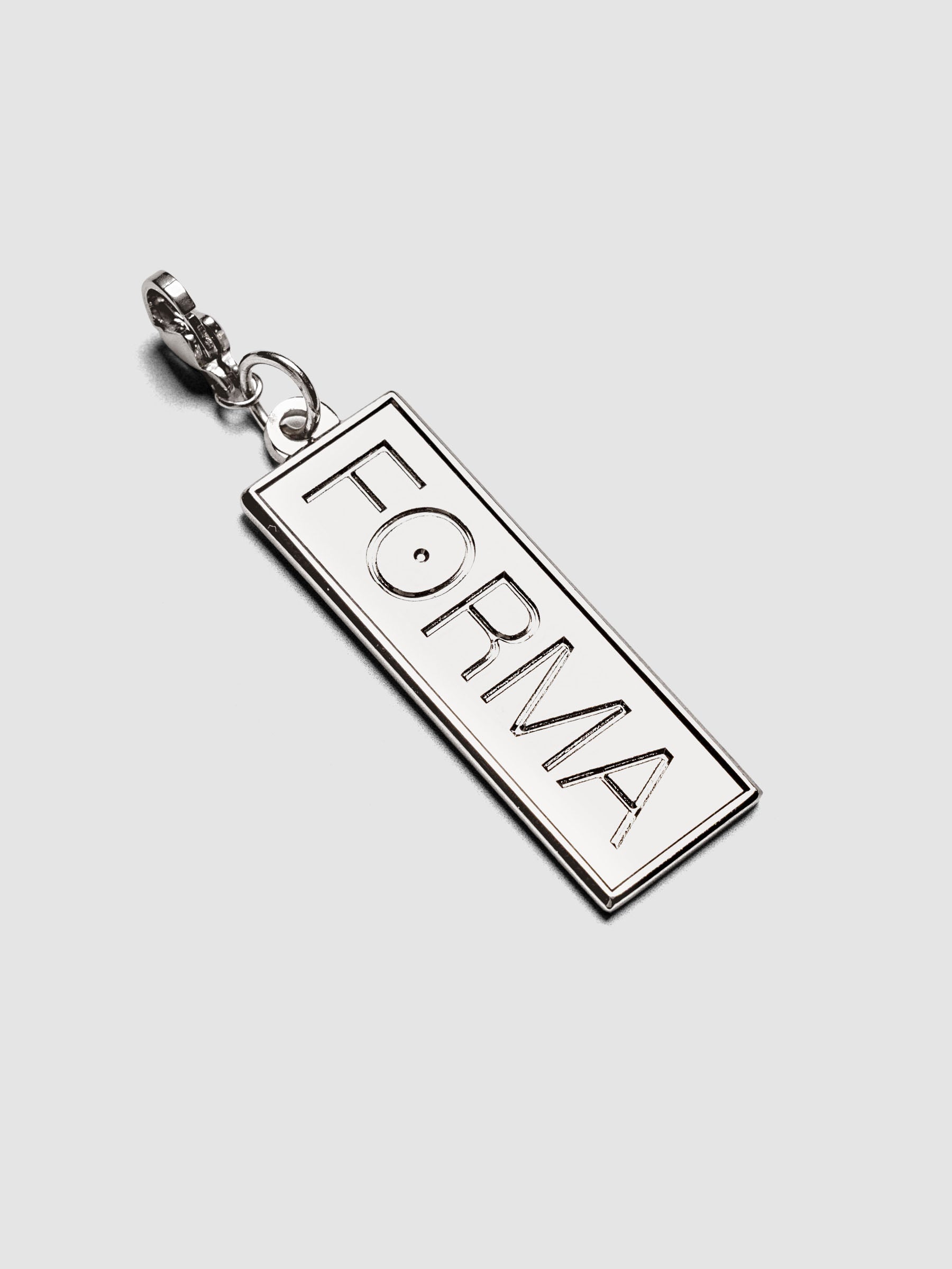 Travel Notebook Charms FORMA charm in embossed silver metal with lobster clasp attachment