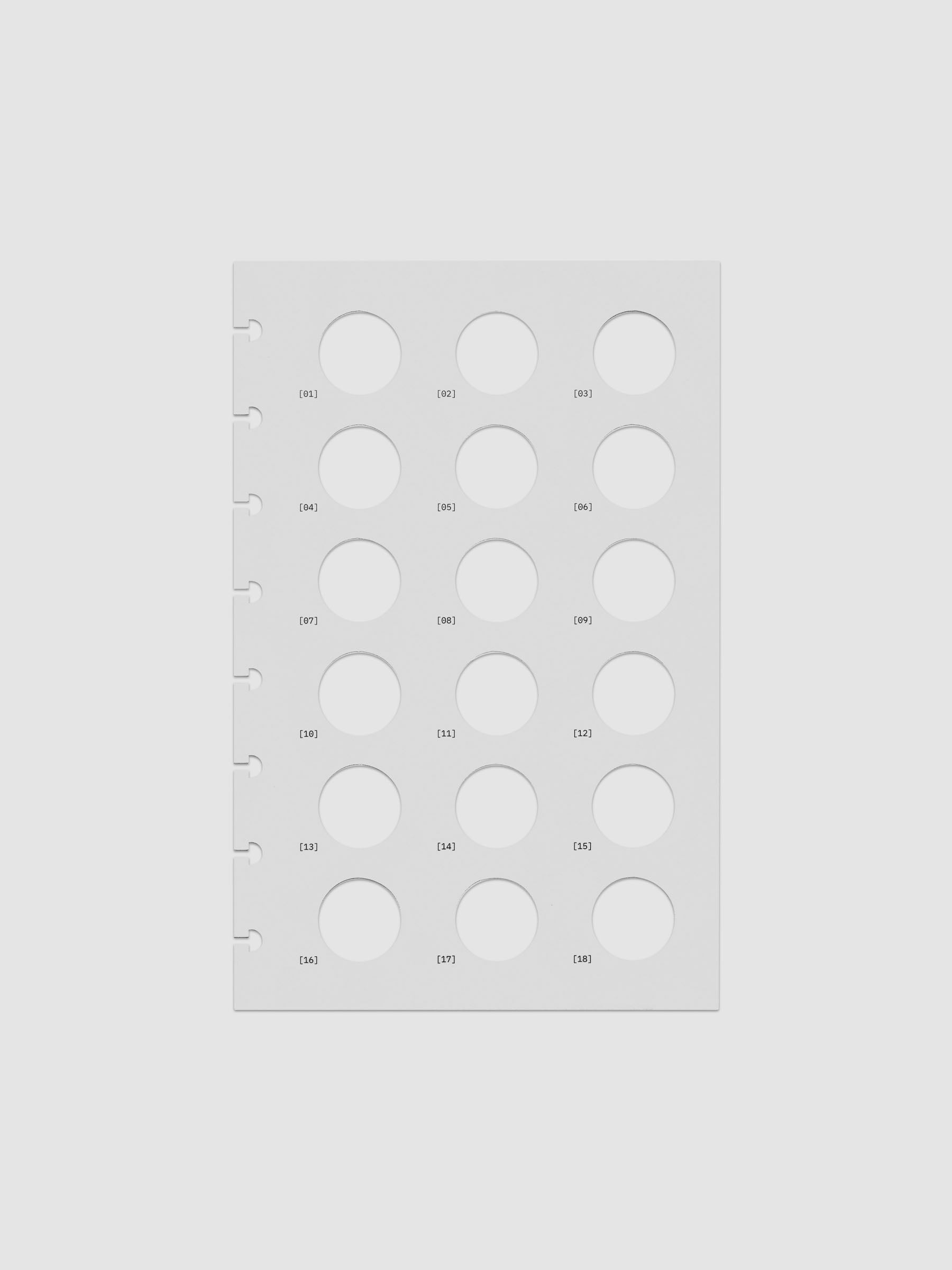 One transparent dashboard with 18 circular cut outs. One piece from the Inner Blueprint Dashboard Duo shown in size Half Letter.