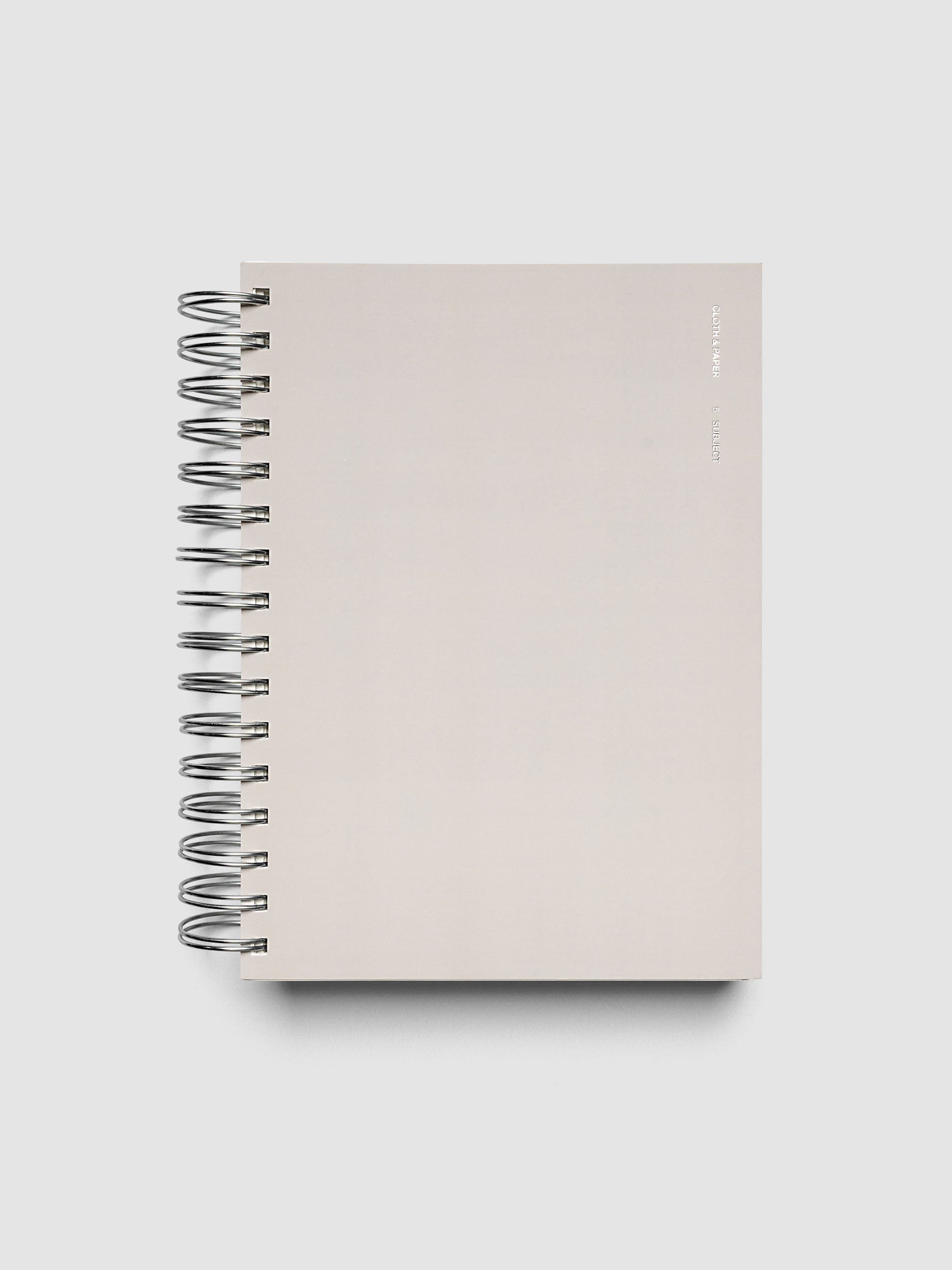 5 Subject Notebook A5 Punch front cover angled view showing silver wire spiral binding