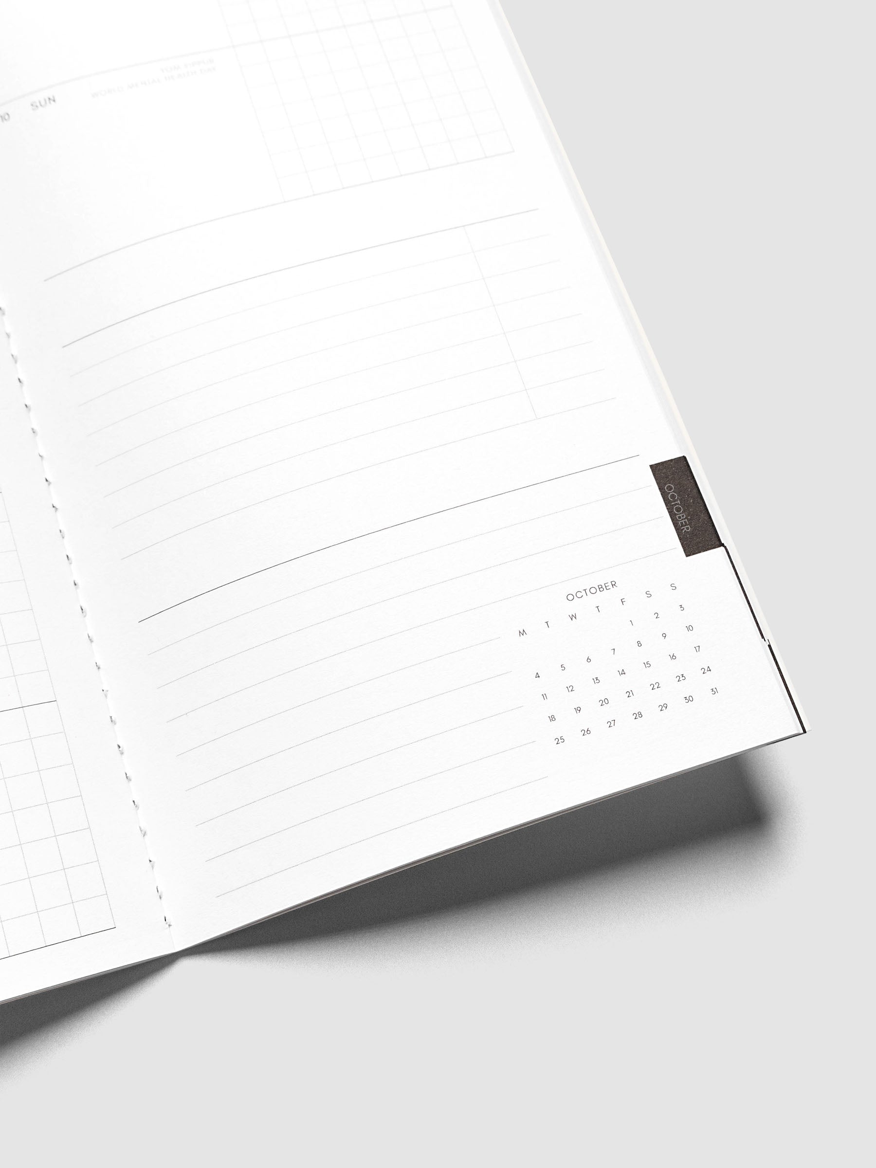 Close-up of the bottom of the right page of the Jul–Dec 2027 Dated Travel Notebook, showing the lined notes section and month-at-a-glance view
