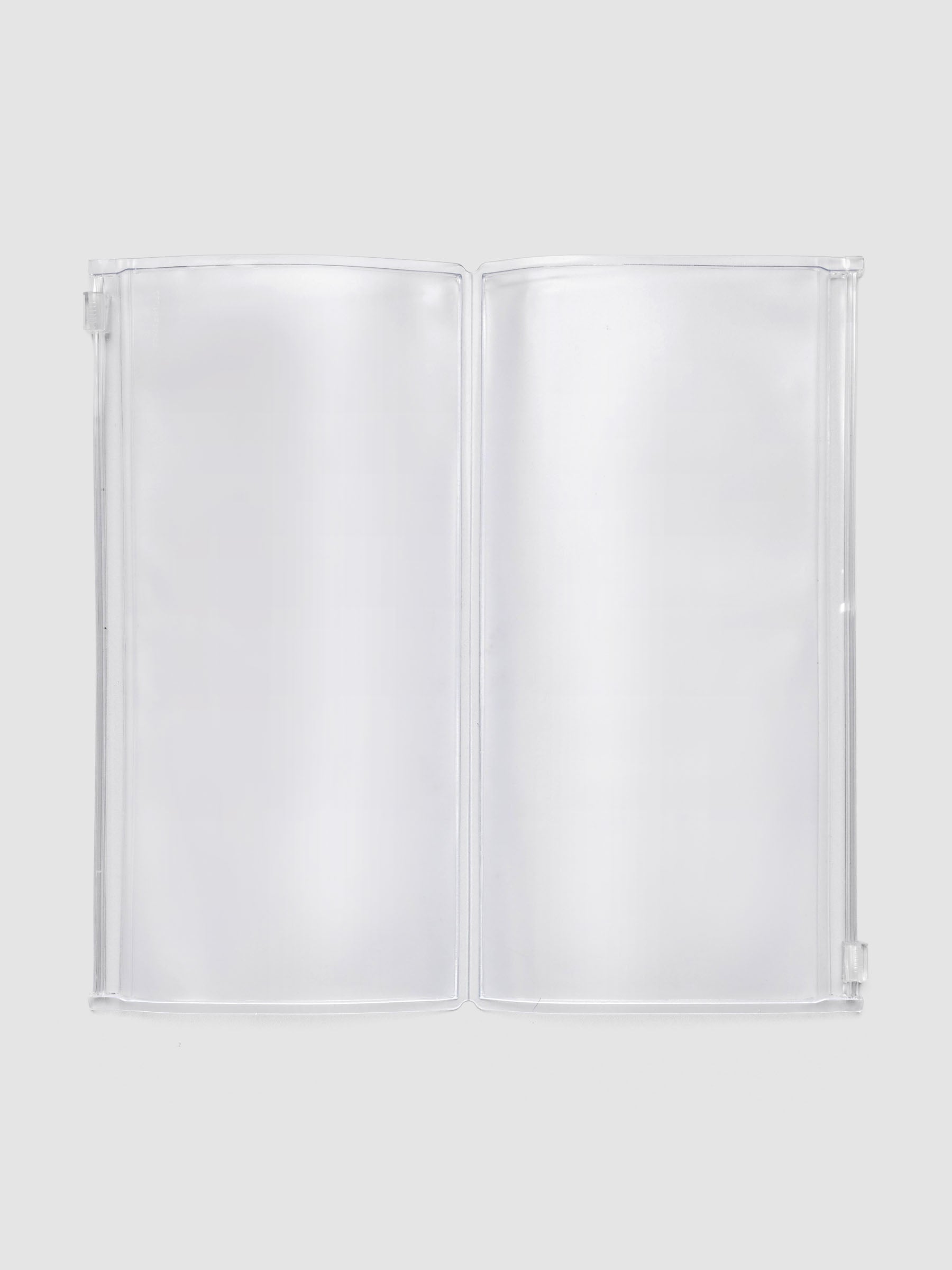 Storage Holder Travel Notebook A5 Slim open, showing two empty zippered pouches, frosted clear plastic interior