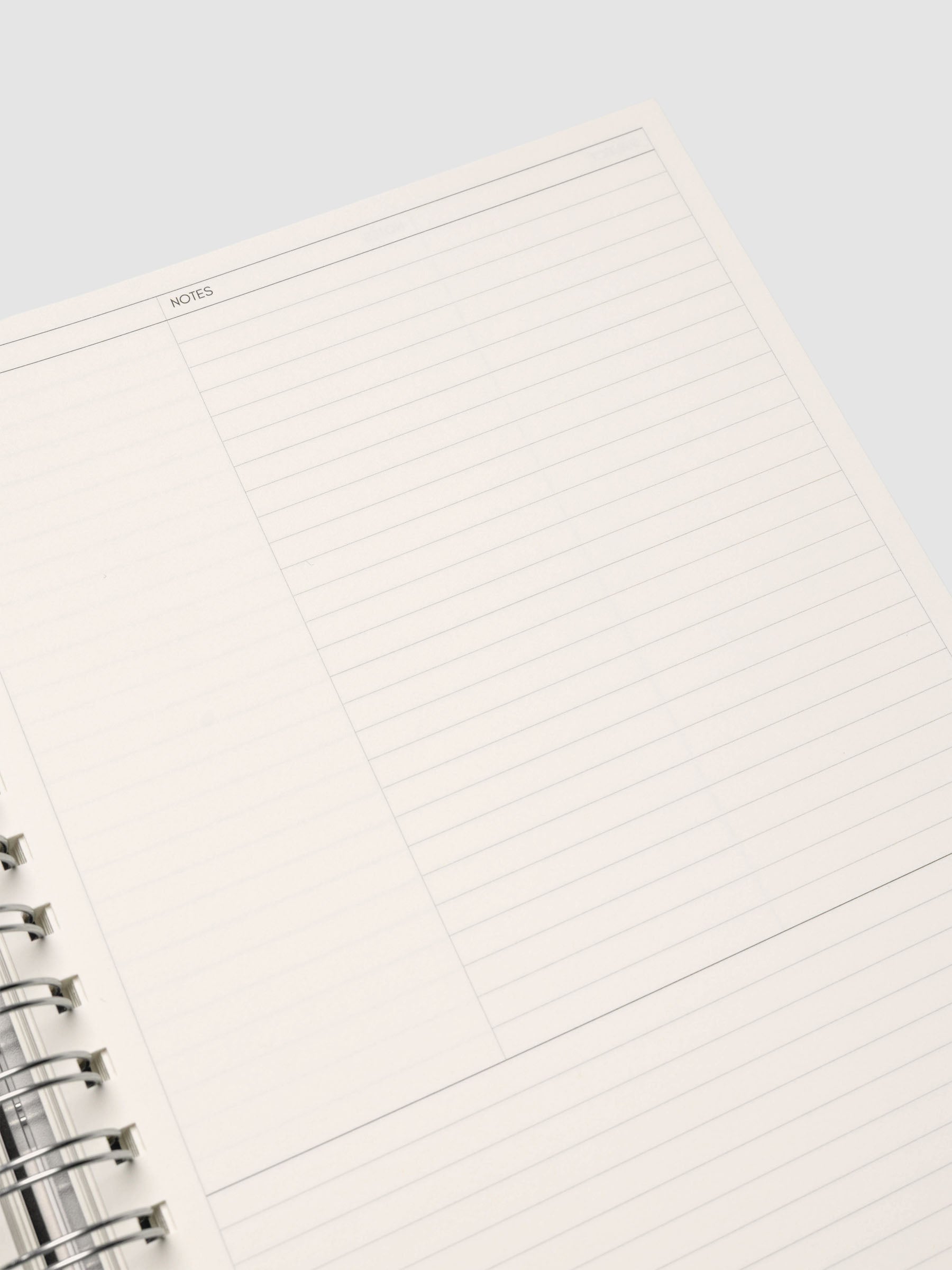Spiral Notebook in size HP Classic and color Apollo (blue) shown open displaying Column Note interior layout.