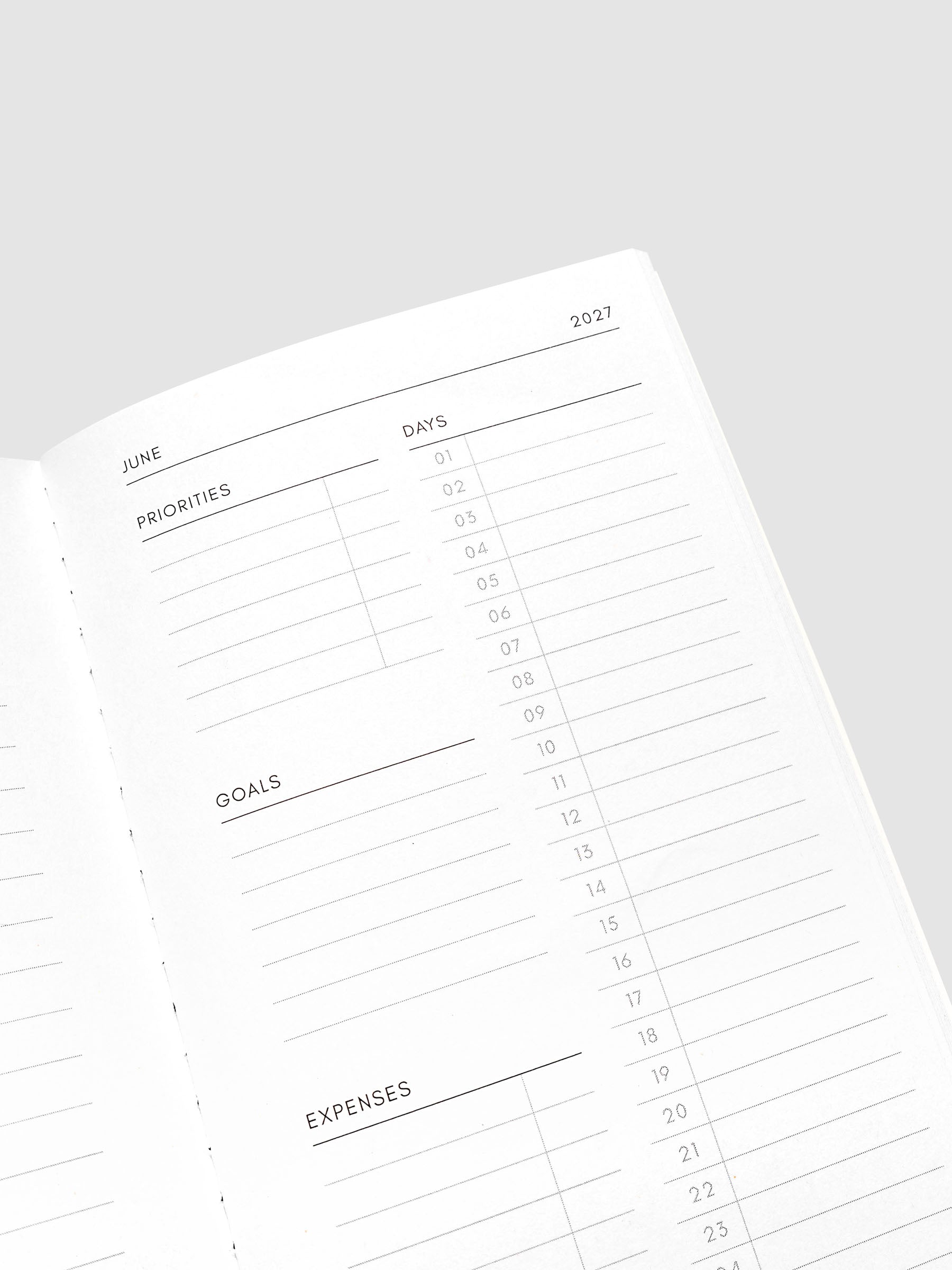 Close-up of the top of the right page of the 2027 Dated Travel Notebook Monthly in Pocket Plus size, showing the days, priorities, goals, and expenses sections