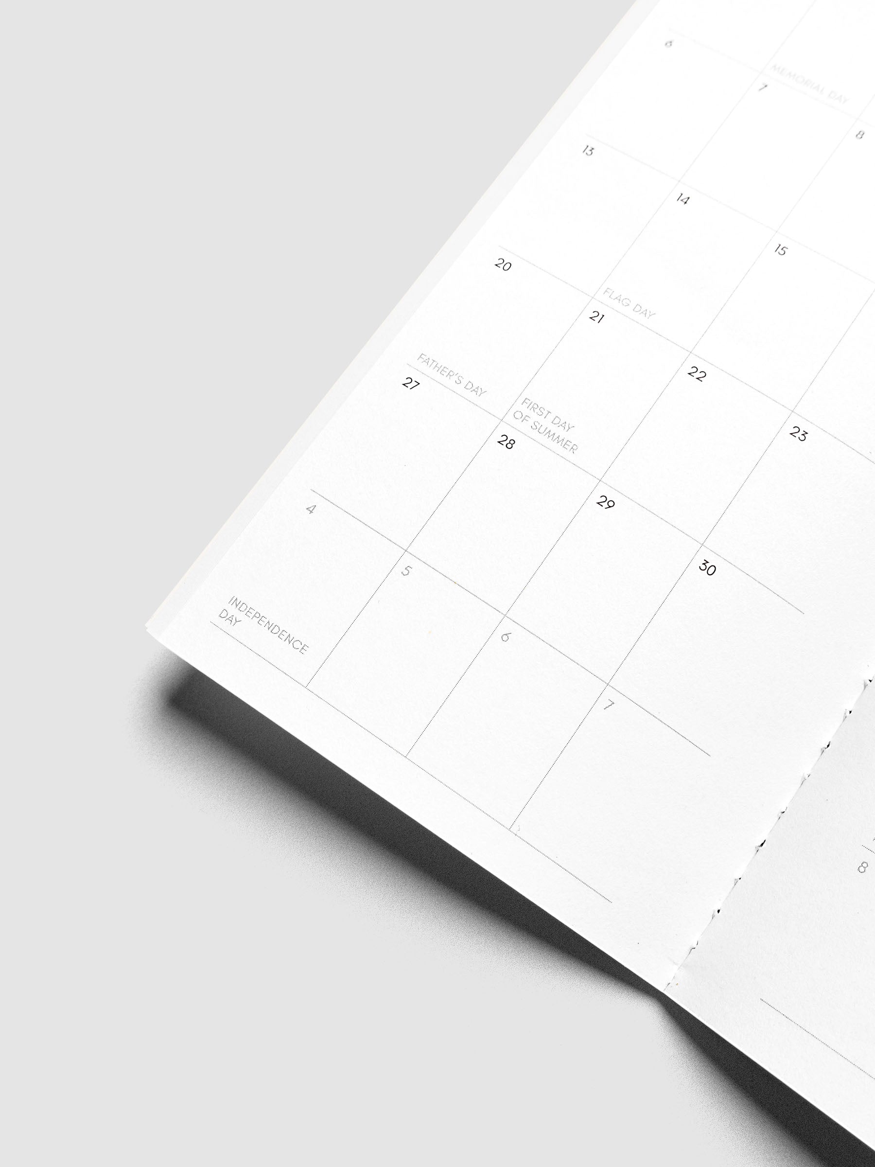 Close-up of the top of the right page of the 2027 Dated Travel Notebook Monthly in Pocket Plus size, showing the dated calendar grid and notes section