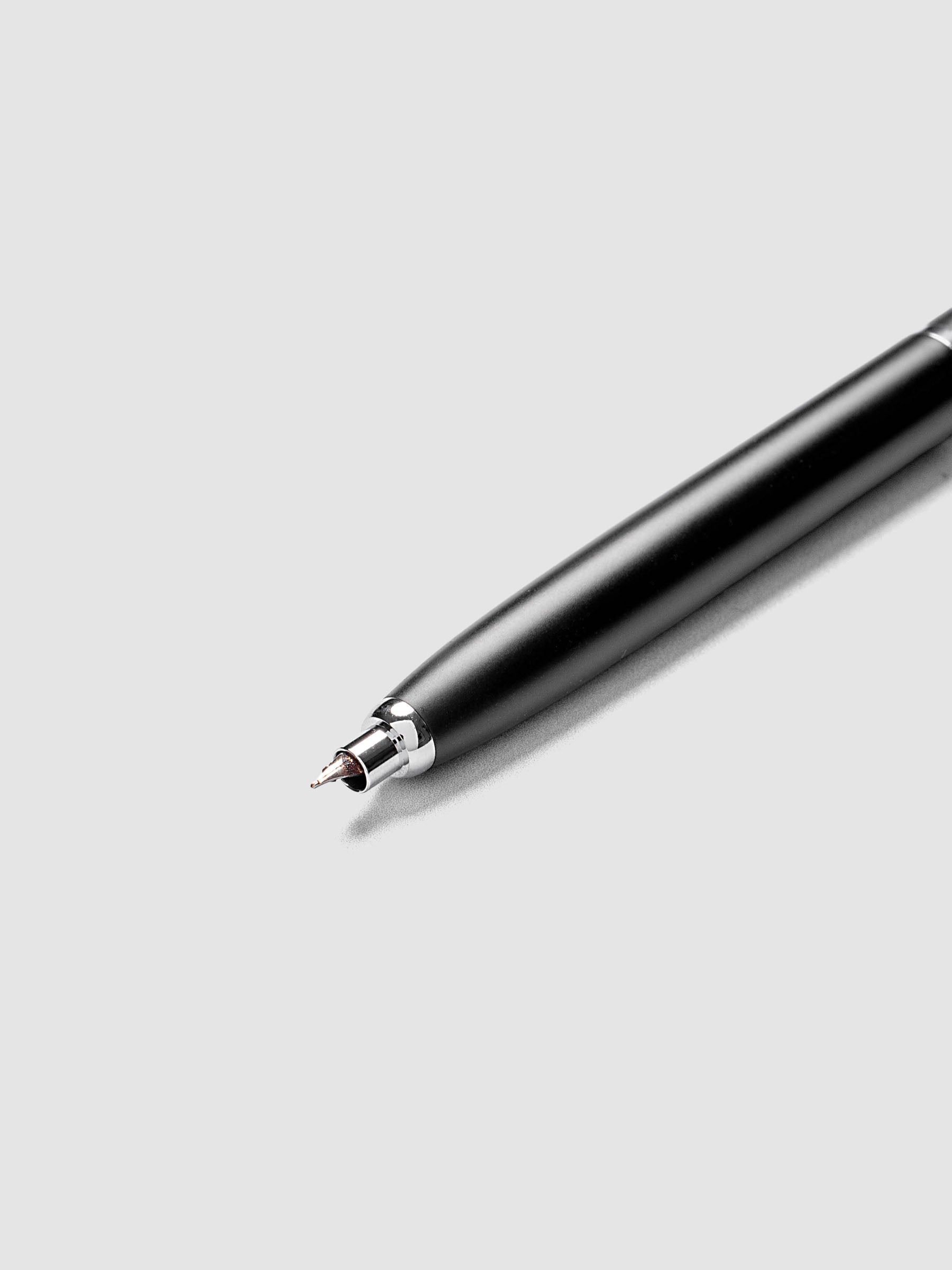 Medium close-up of the Lanbitou Fountain Pen nib and front section, showing the hooded nib design and matte textured barrel