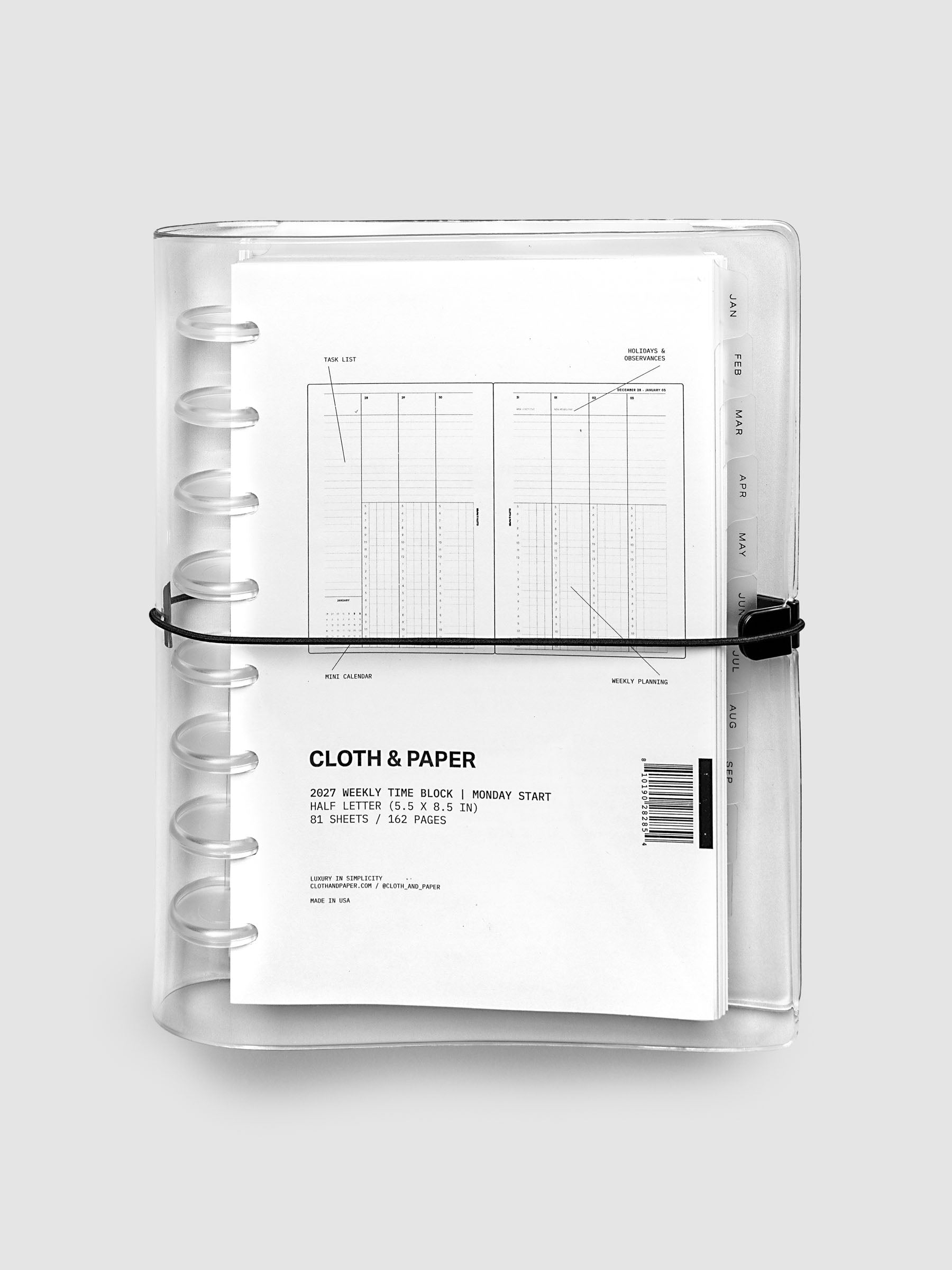 Closed clear vinyl planner cover with clear 8-disc binding and a black elastic closure, front page displaying a labeled weekly time block spread with task list, holidays and observances, mini calendar, and weekly planning callouts, Half Letter 8-Disc Punch size