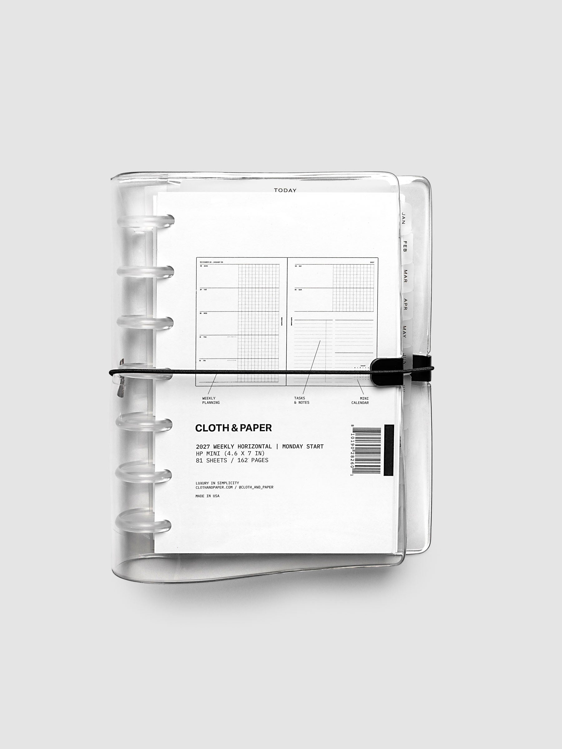 Closed clear vinyl planner cover with clear 7-disc binding and a black elastic closure, front page displaying a labeled weekly horizontal spread with weekly planning, tasks and notes, and mini calendar callouts, HP Mini 7-Disc Punch size
