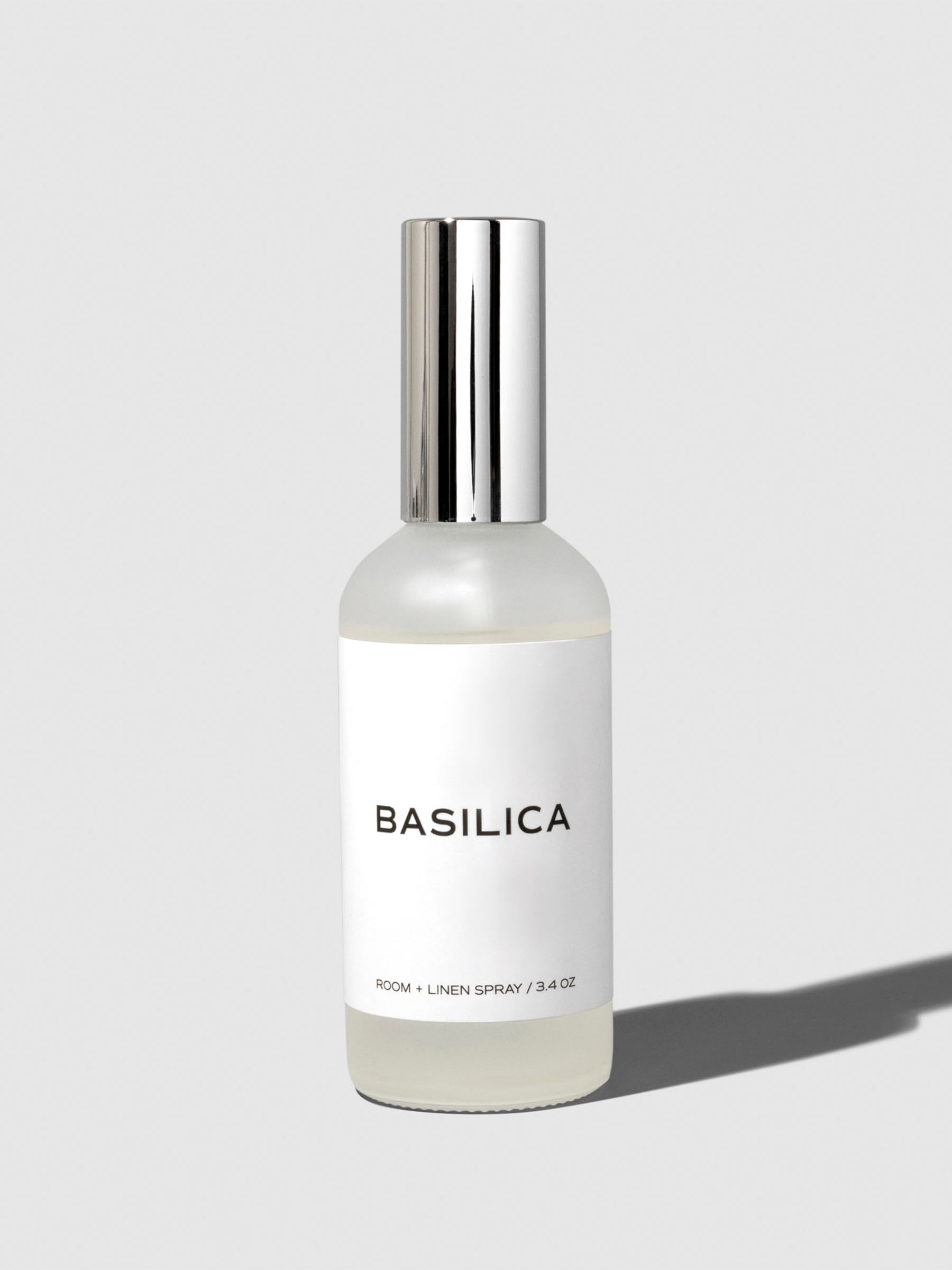 Basilica Room Spray, Cloth and Paper. Spray shown on a neutral background.