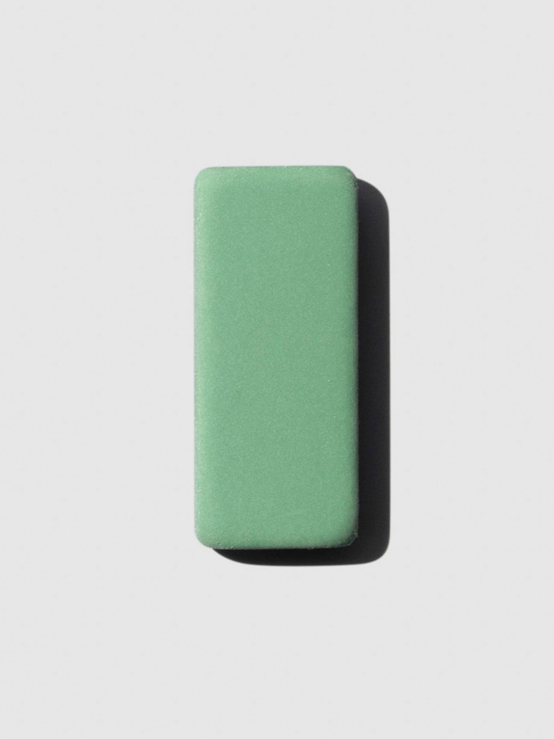 The image shows a close-up of the green color variant of the blackwing replacement eraser.