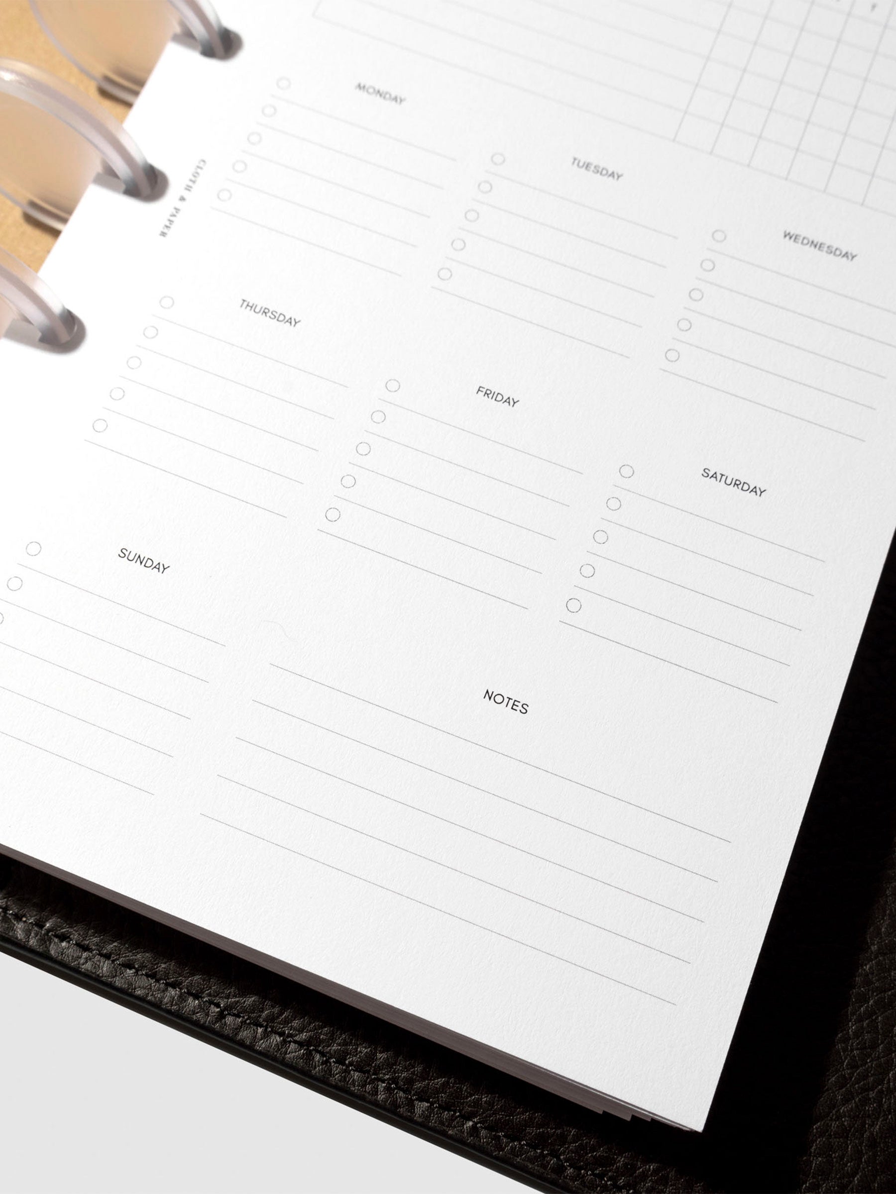 Insert in use inside a black leather planner.