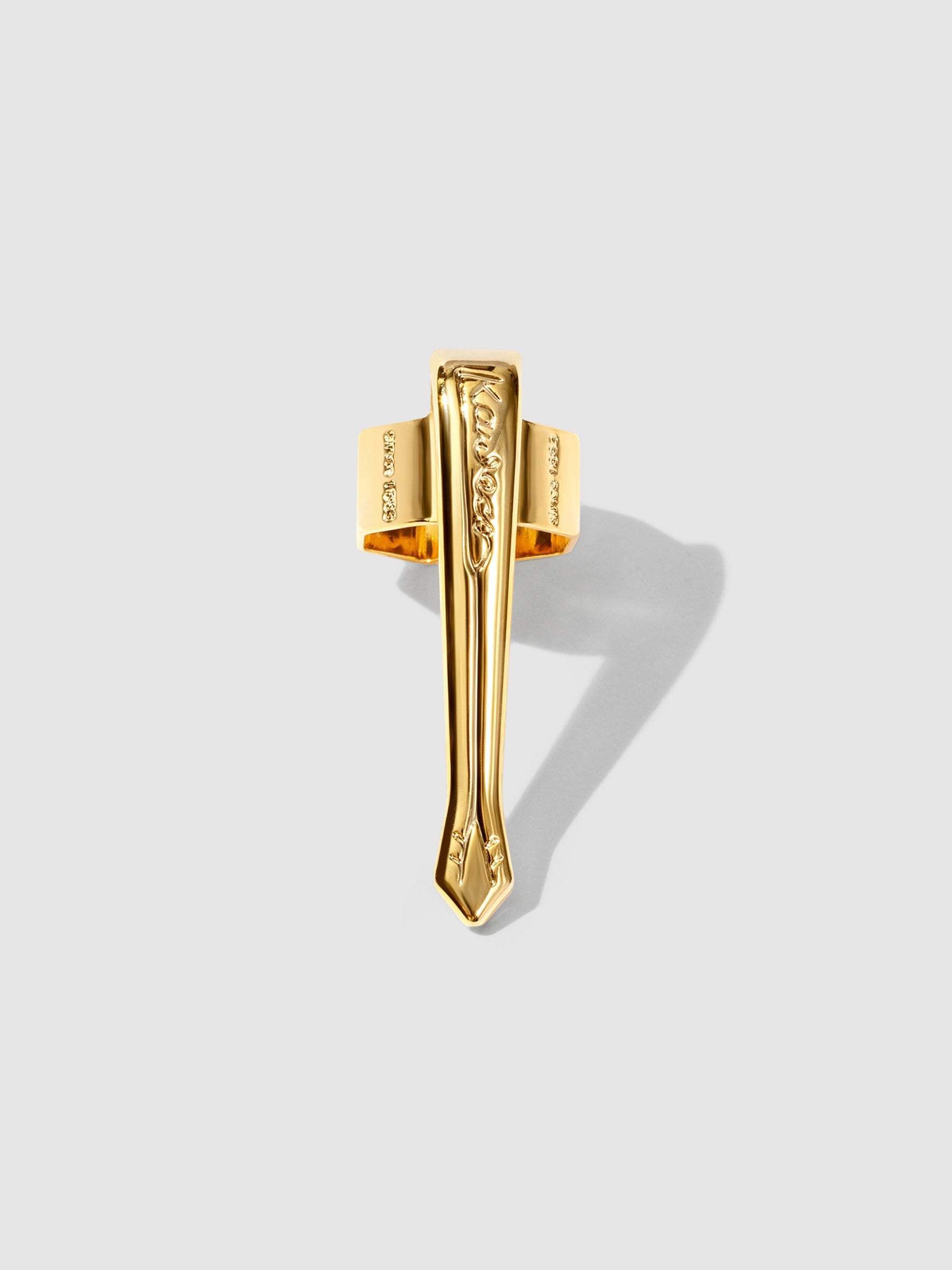 Nostalgic  gold clip displayed on a neutral background.