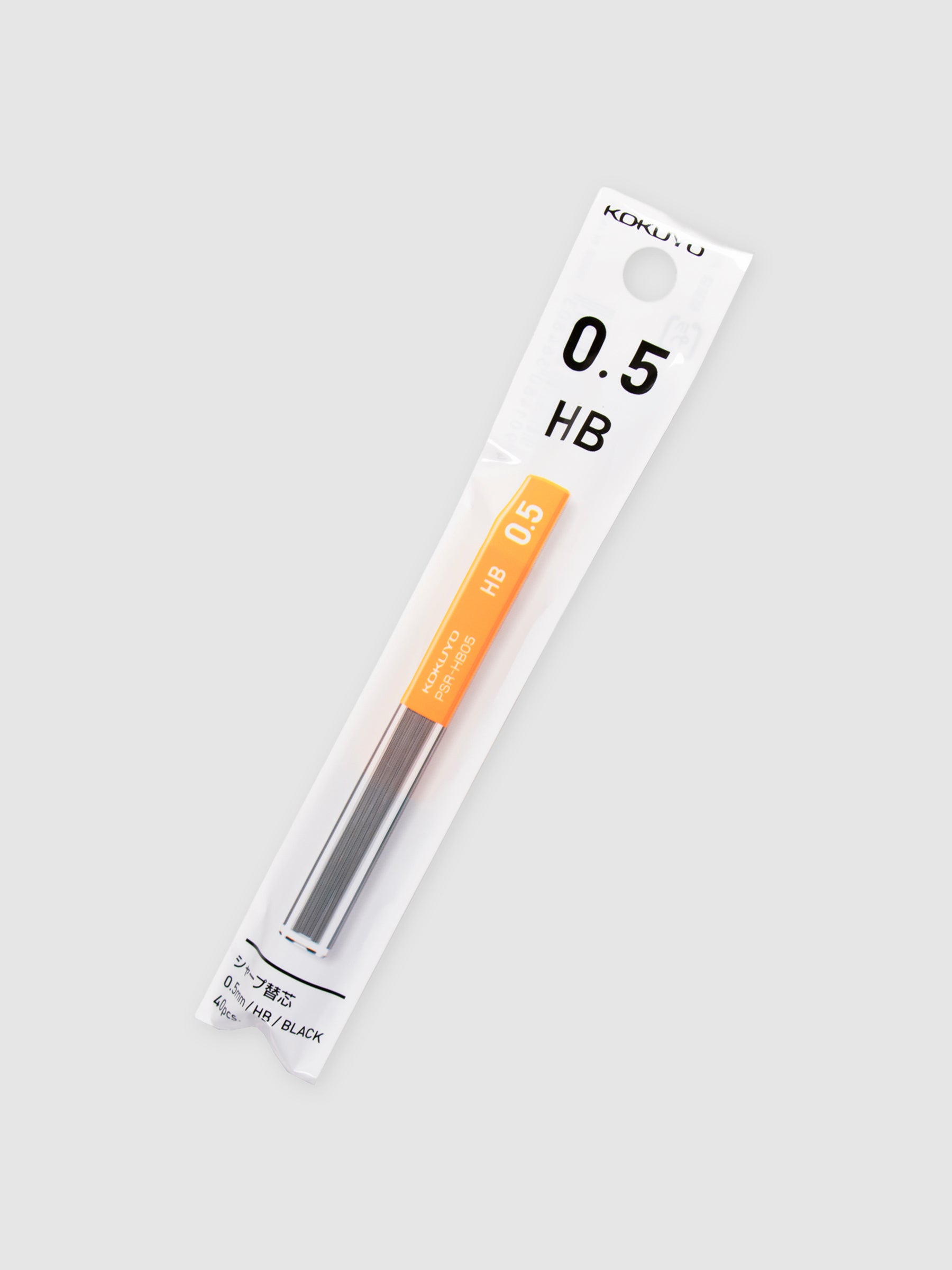 Kokuyo Pencil Lead, 0.5, HB, Cloth and Paper. Lead in its packaging turned to the right against a neutral background.