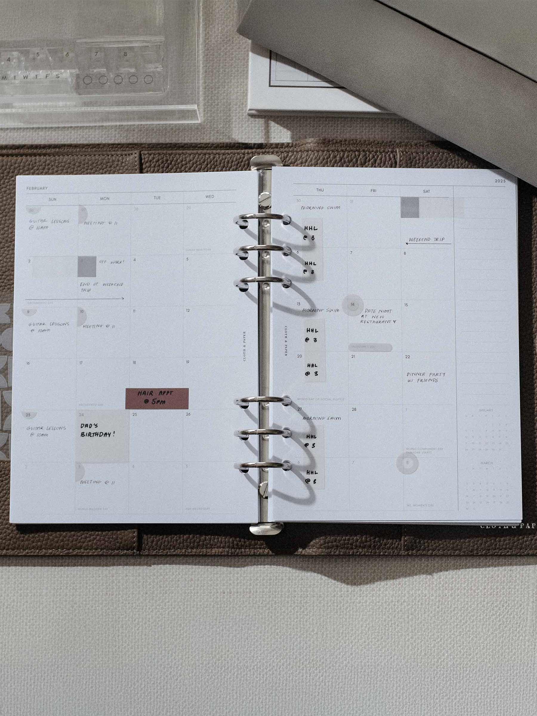 Matchstick Page Flag use inside a brown leather planner.