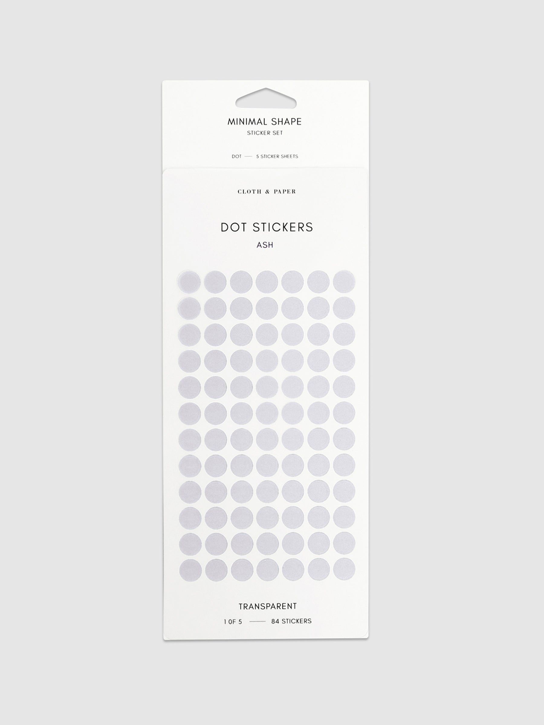Minimal Shape Sticker Set, Transparent Dots, Ash, Cloth and Paper. Dot stickers in their packaging on a neutral background.