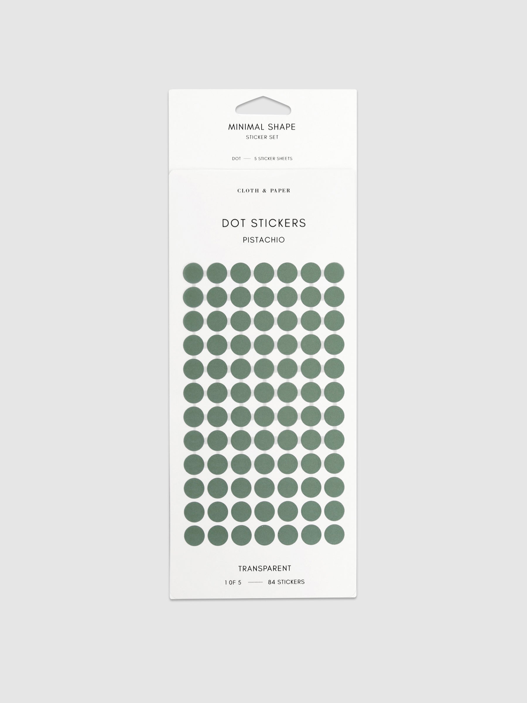 Pistachio dot stickers in their packaging on a neutral background.