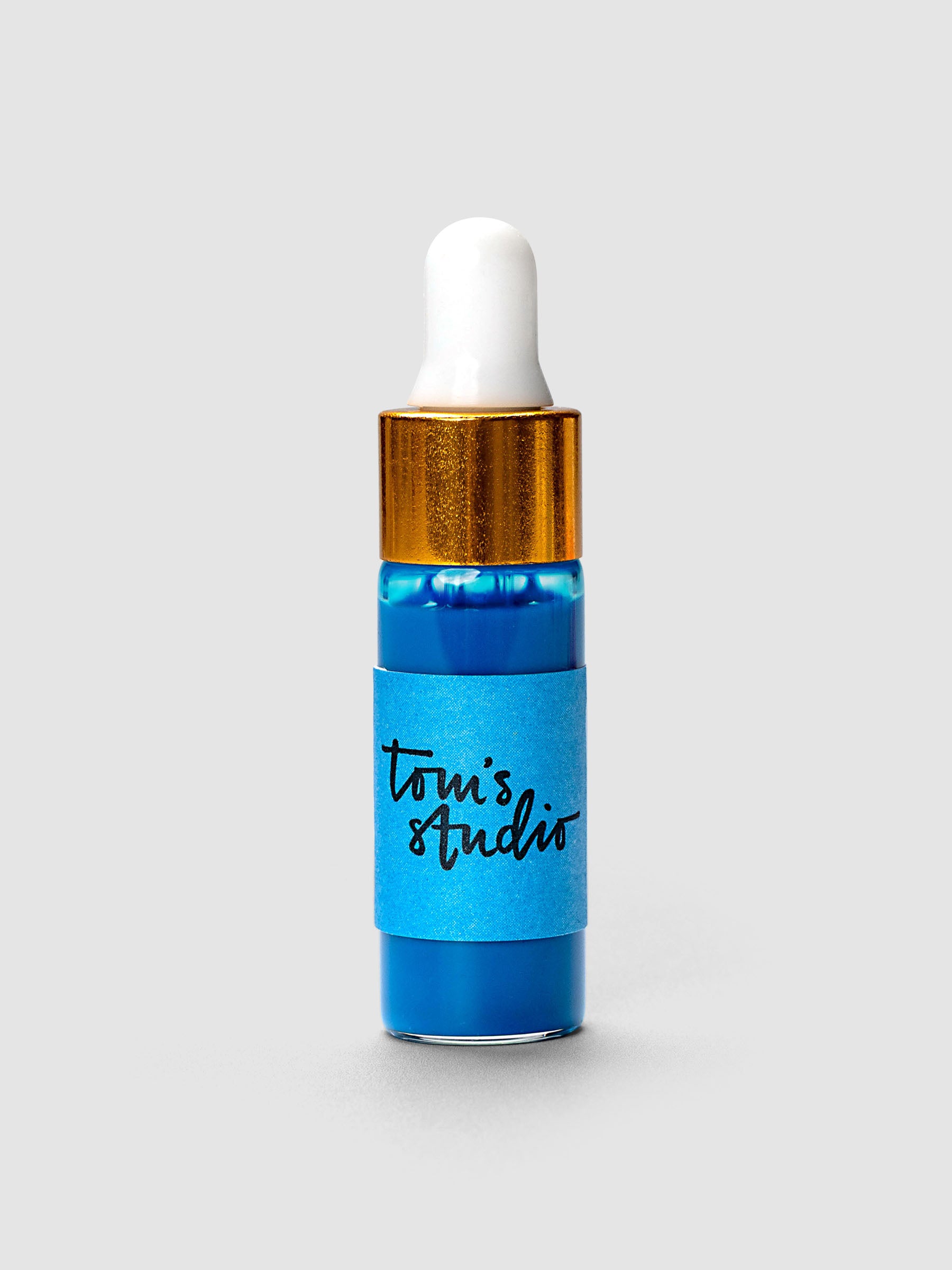 Tom's Studio Mini Highlighter Ink bottle with gold cap and white dropper in blue