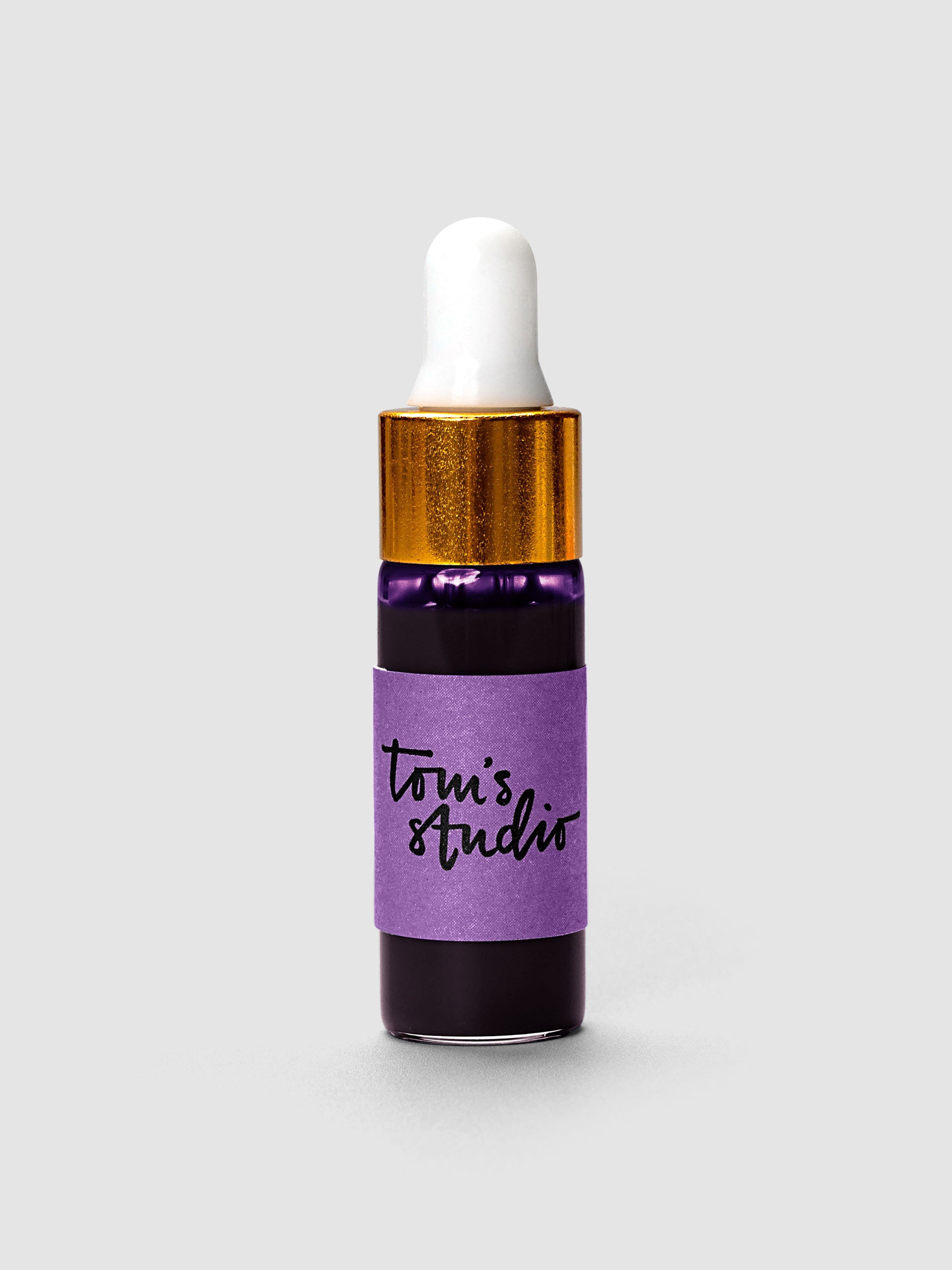Tom's Studio Mini Highlighter Ink bottle with gold cap and white dropper in purple