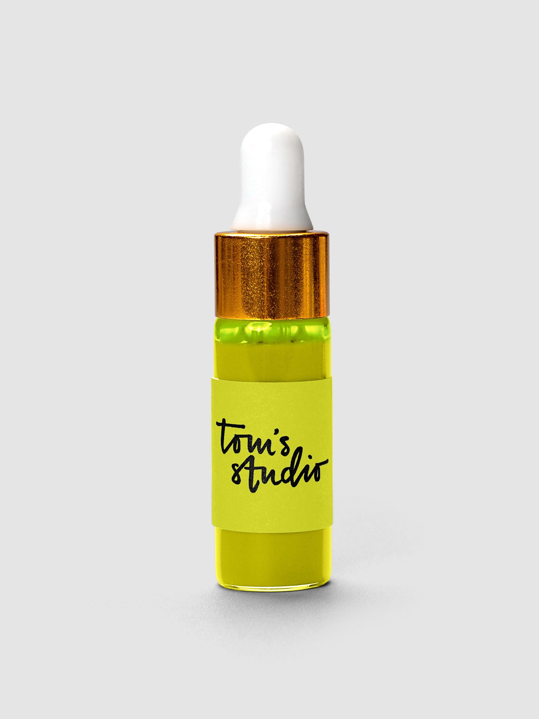 Tom's Studio Mini Highlighter Ink bottle with gold cap and white dropper in yellow