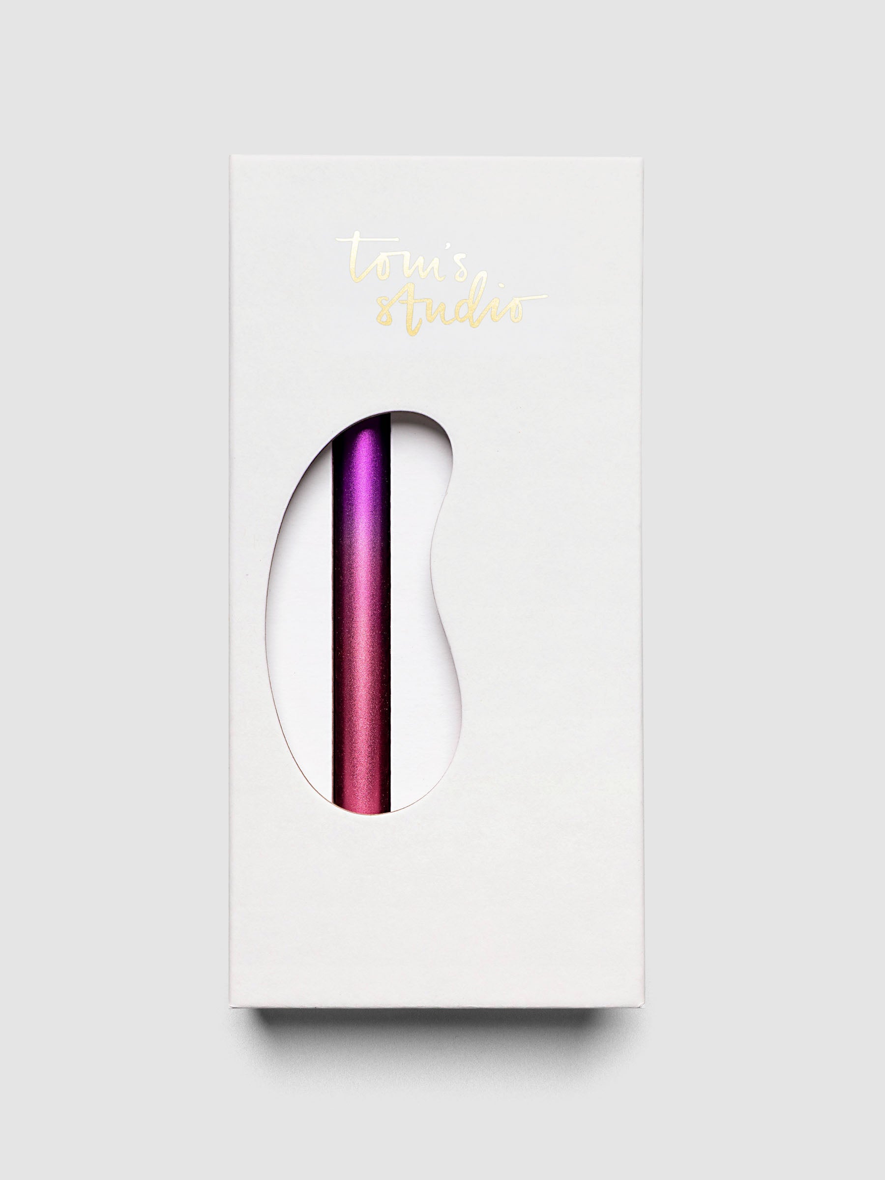 Tom's Studio Ori Refillable Highlighter in white packaging box with purple and pink ombre pen visible through cutout window