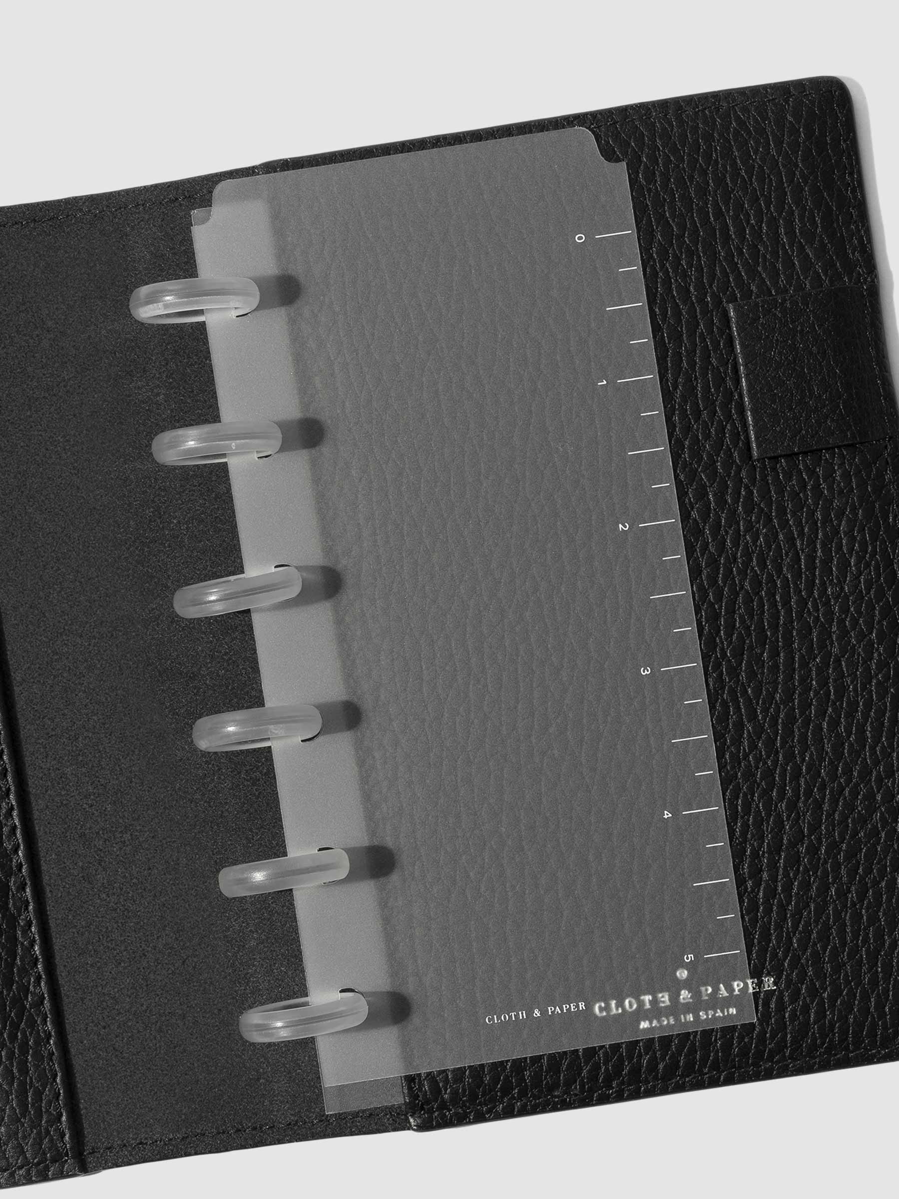CP Petite page marker displayed inside a black leather folio.